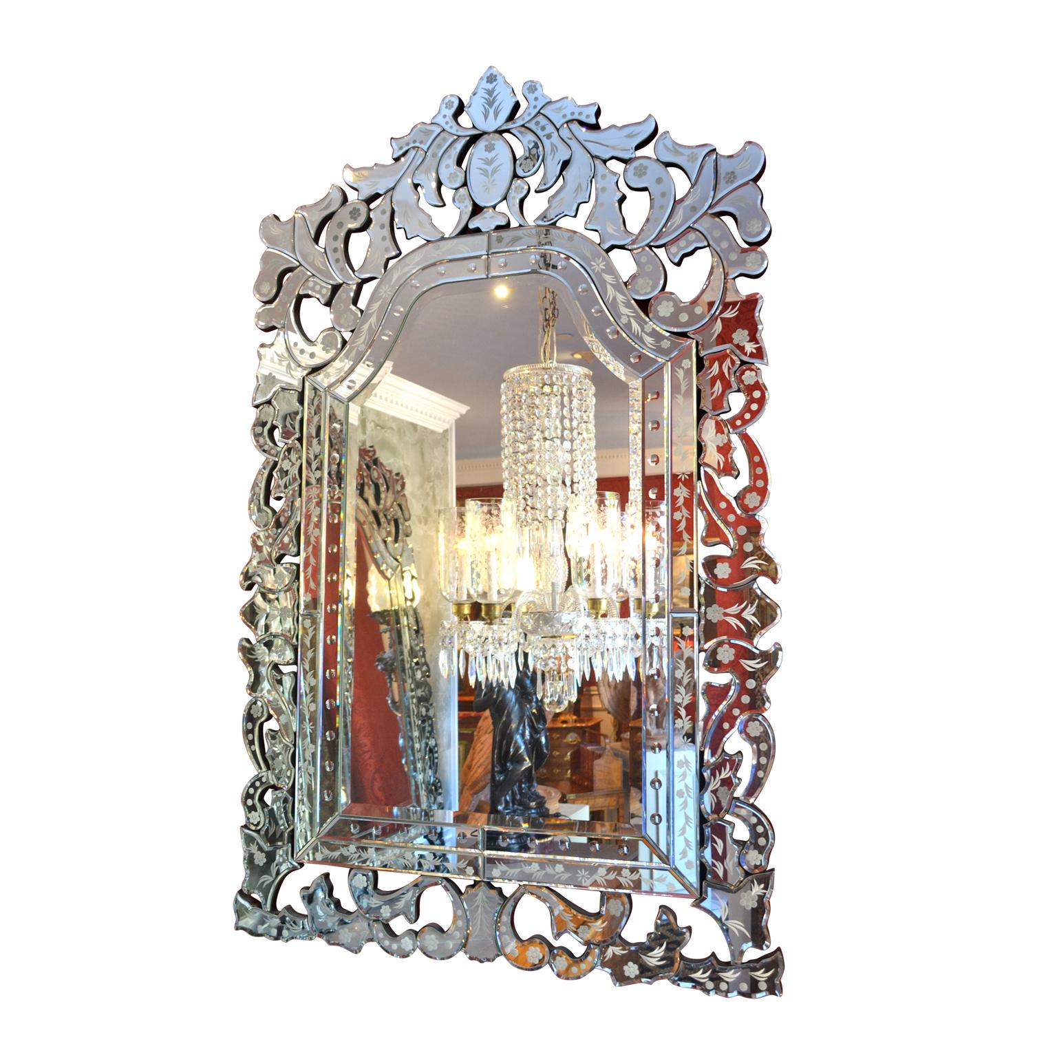 A decorative pair of contemporary Venetian beveled glass mirrors of almost rectangular shape with domed tops.
