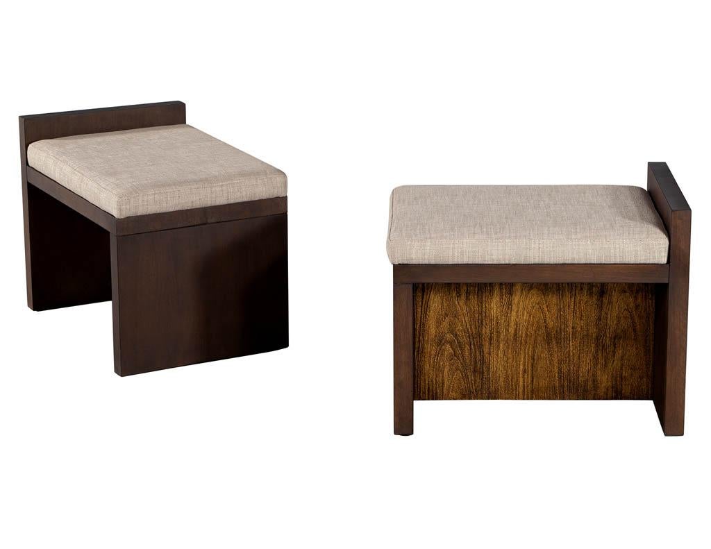 Pair of Modern walnut benches by Lara Mann. Simplistic modern styling in rich walnut woods and upholstered seat cushion. Contrasting center panel adds texture and flare to the design. Finished in a satin espresso walnut color with beige linen fabric