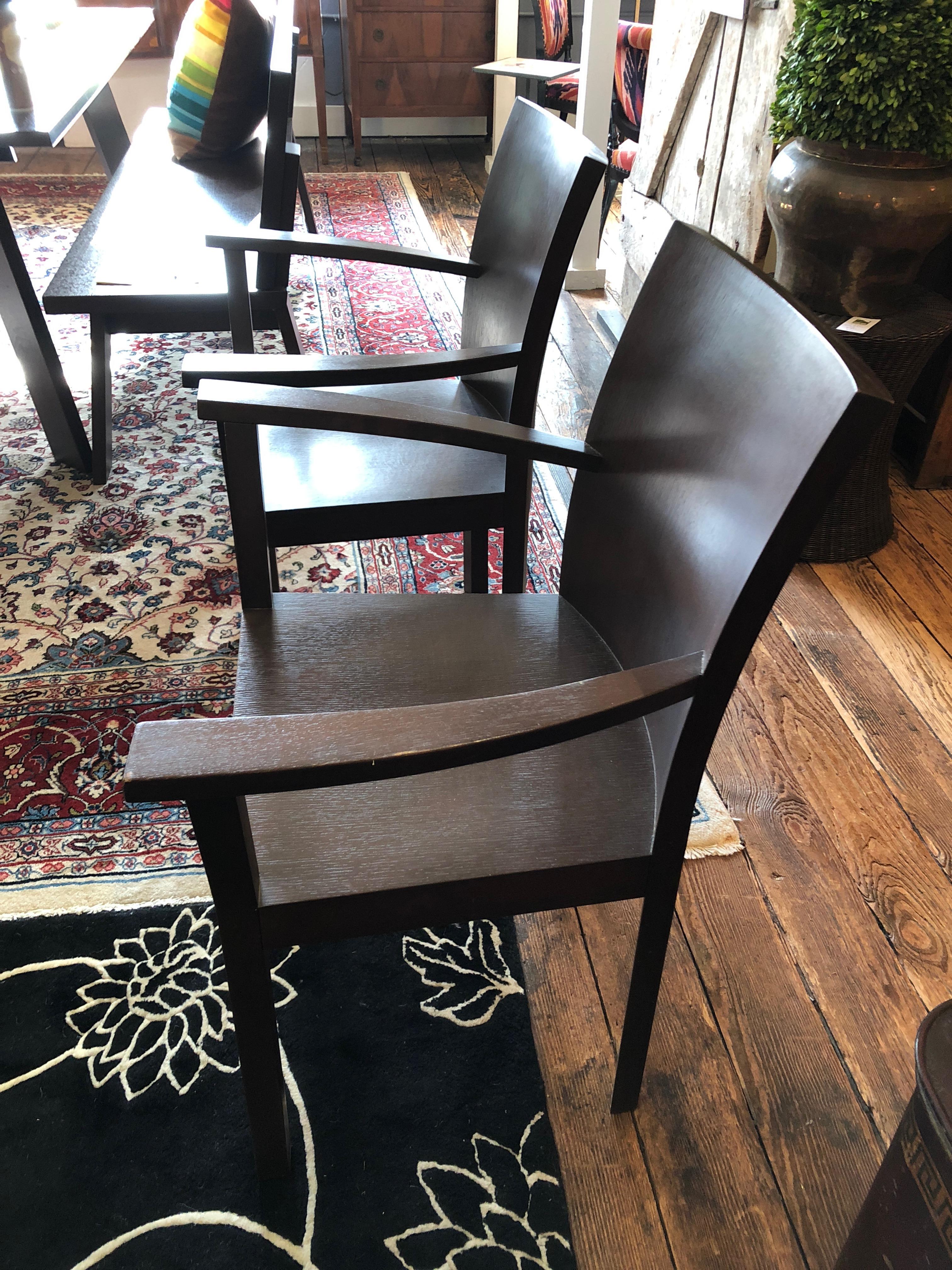 Sophisticated armchairs by the German maker Bulthaup, having clean lines and handsome walnut construction.
There's a matching table and benches for sale as well.