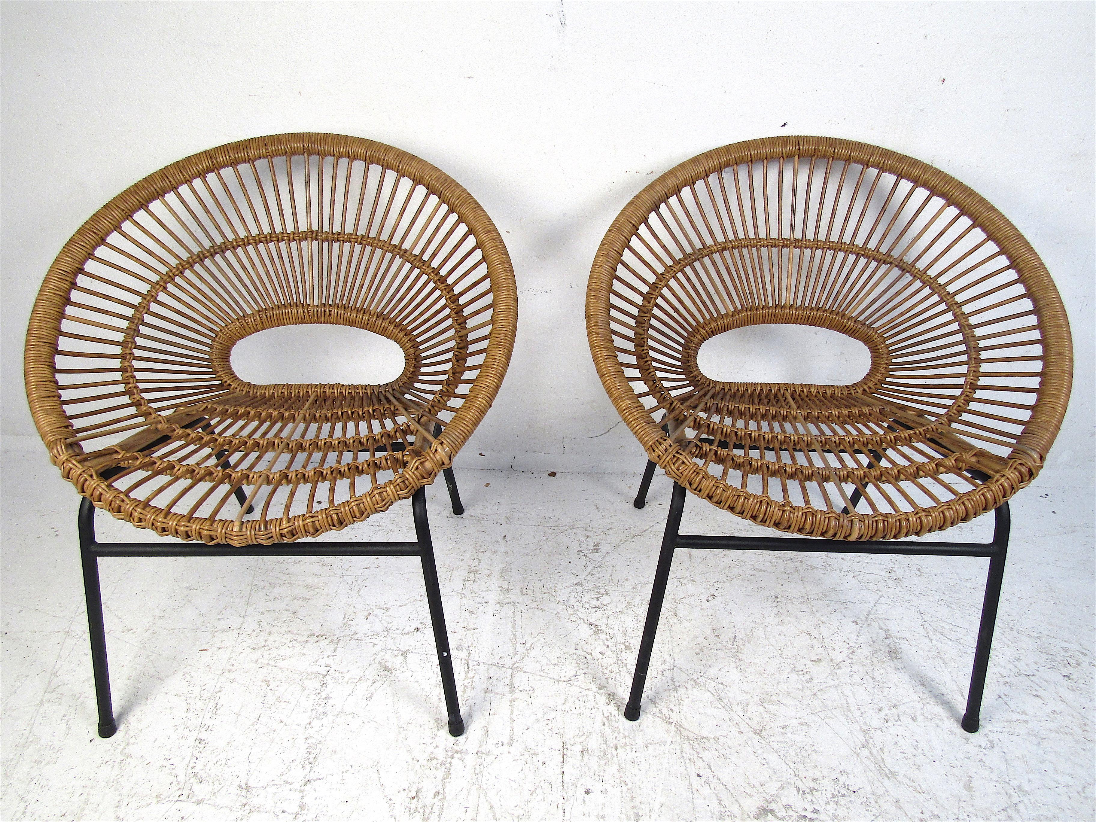 Interesting pair of modern hoop chairs with wicker seating. Sleek design with metal legs supporting the chairs. Please confirm item location with dealer (NJ or NY).