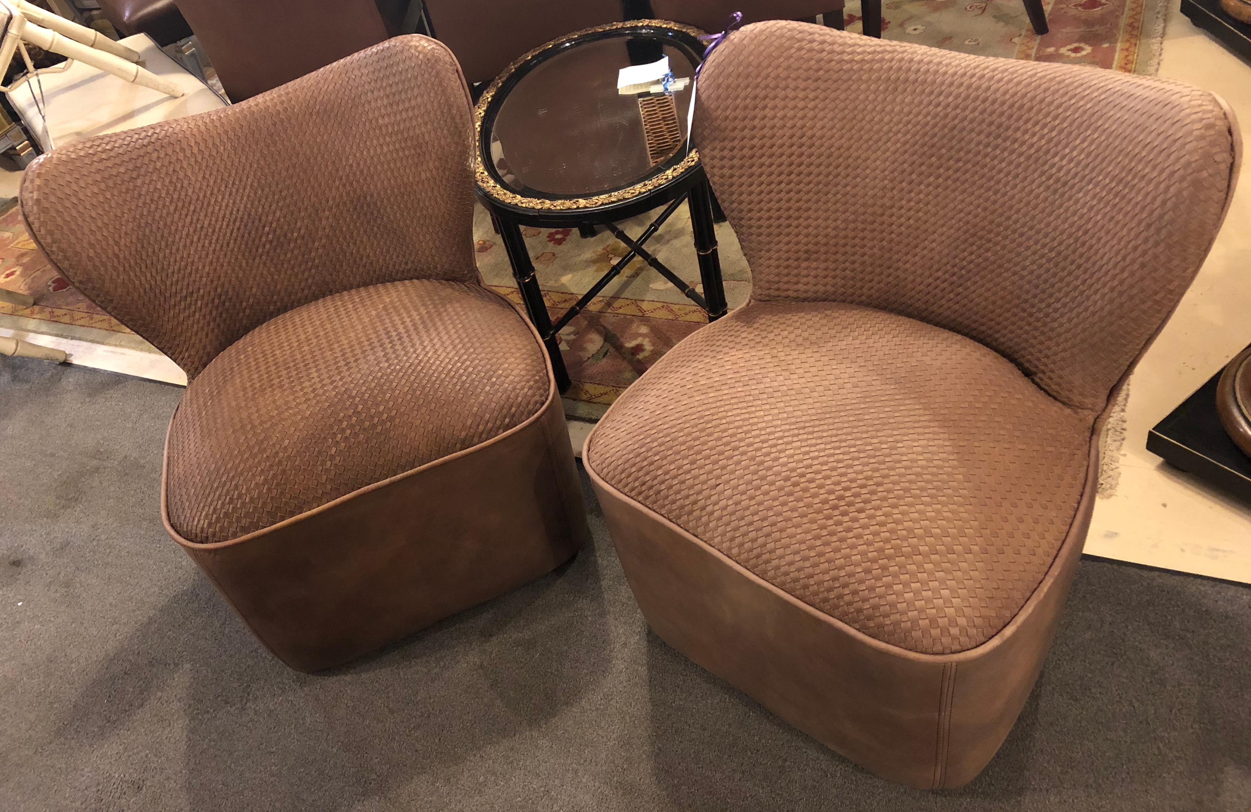 A pair of woven modern leather seat and backrest side chairs in brown leather tweed. The pair are quite comfortable. Very fashionable and desirable.