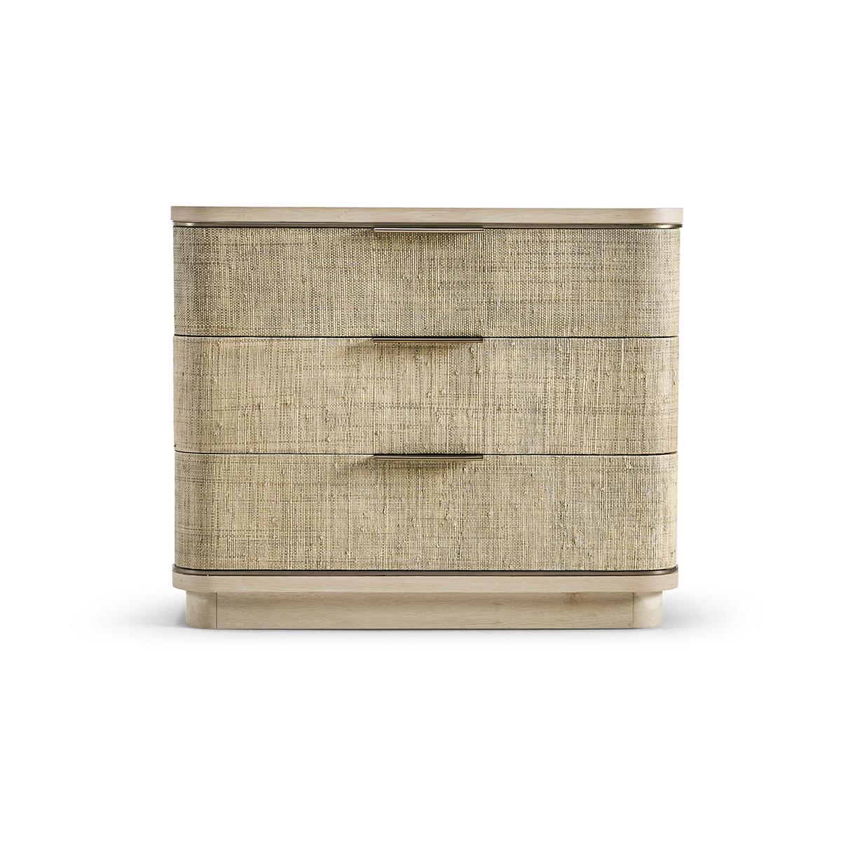 Modern woven nightstand, a beautifully crafted piece is born from passion and boasts incredible aesthetic details that are sure to take your breath away.

The nightstand's three bleached oak drawers are wrapped in grasscloth, adding a subtle