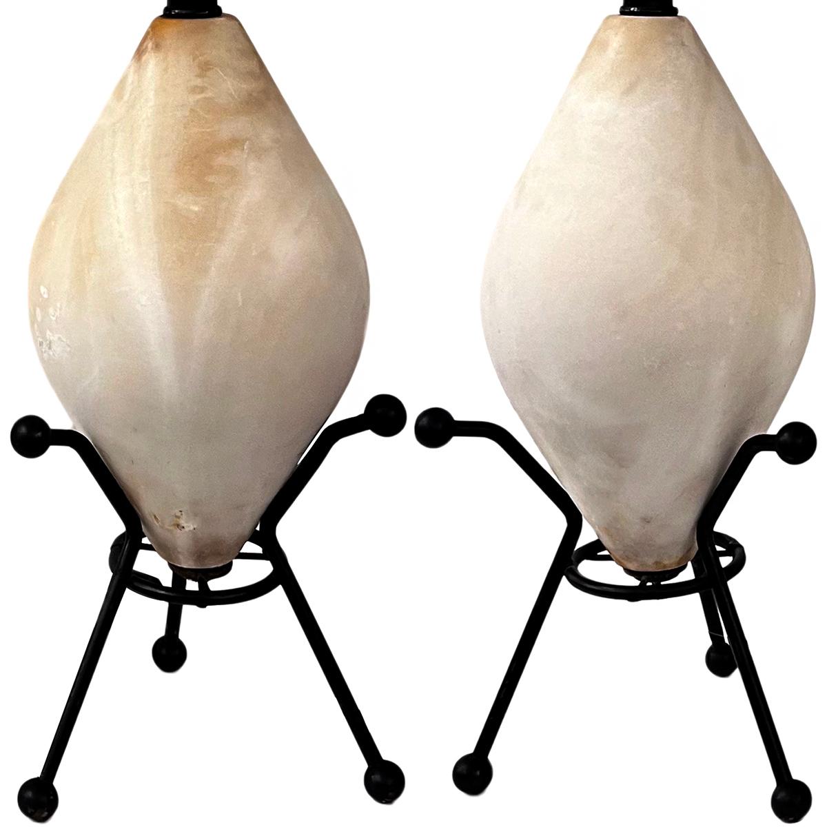 Pair of circa 1950s iron and carved alabaster Italian lamps.

Measurements:
Height of body: 15.75