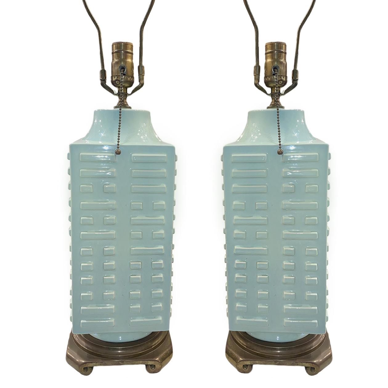 A pair of circa 1940s French celadon porcelain table lamps with bronze bases with geometric decoration on body.

Measurements:
Height of body 17?
Height to shade rest 26.5?