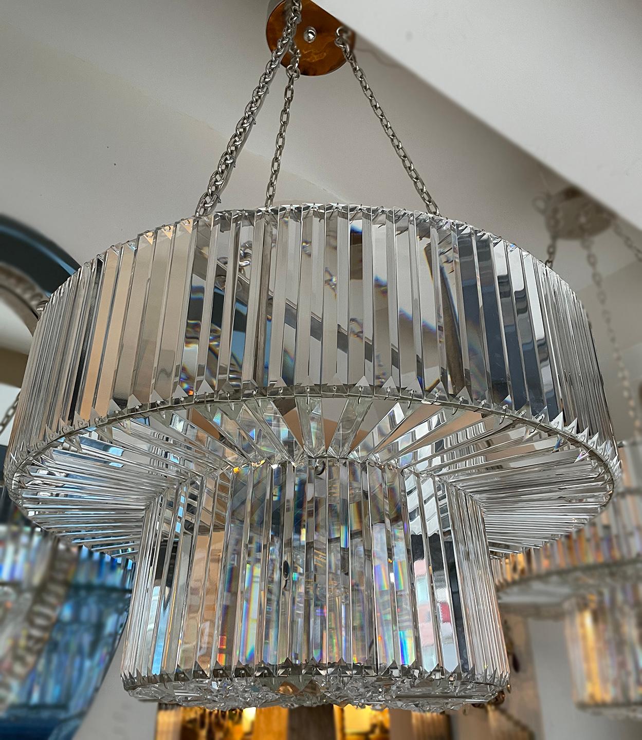 A pair of circa 1950's French moderne crystal light fixture with 8 interior lights. Sold individually.

Measurements:
Diameter: 29