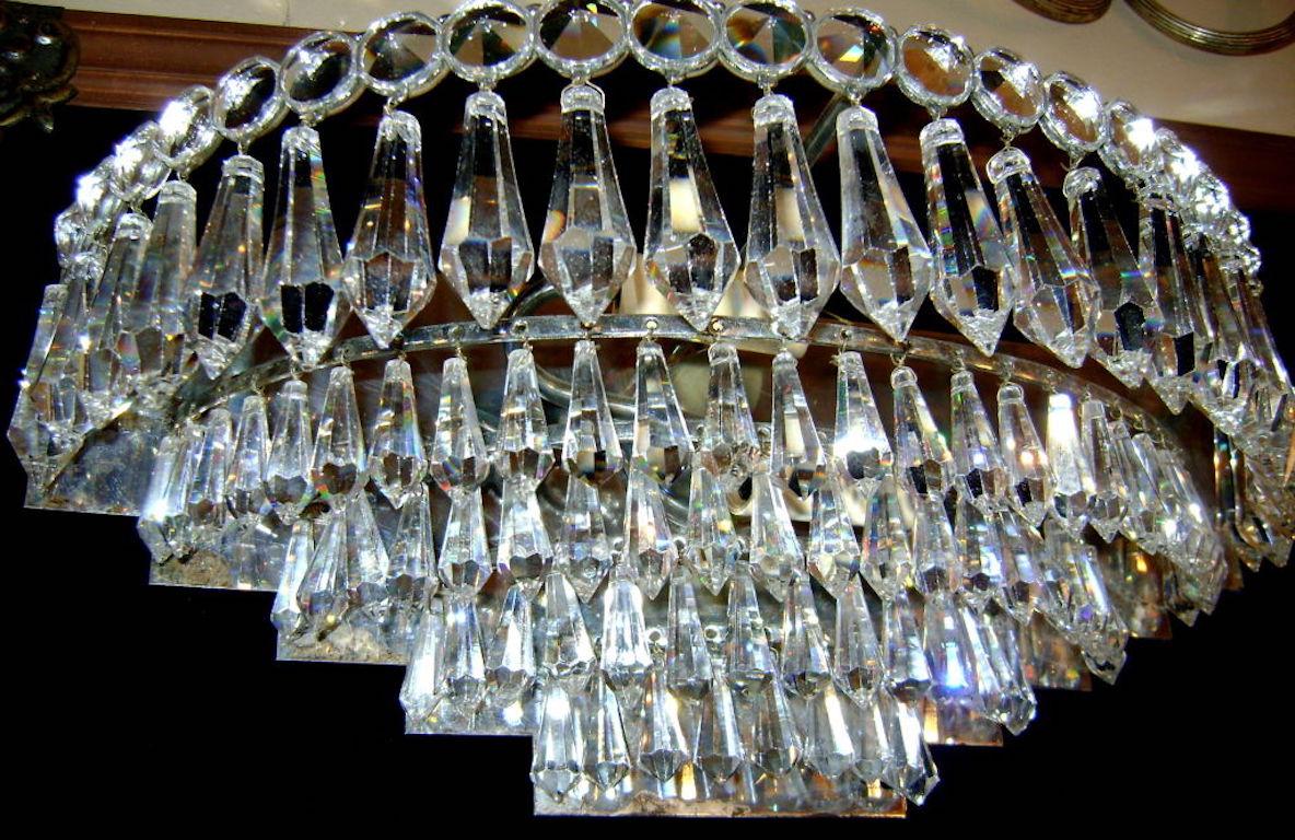 Pair of circa 1940s Italian nickel-plated sconces with crystal drops and two interior lights.

Measurements:
Height 6.5