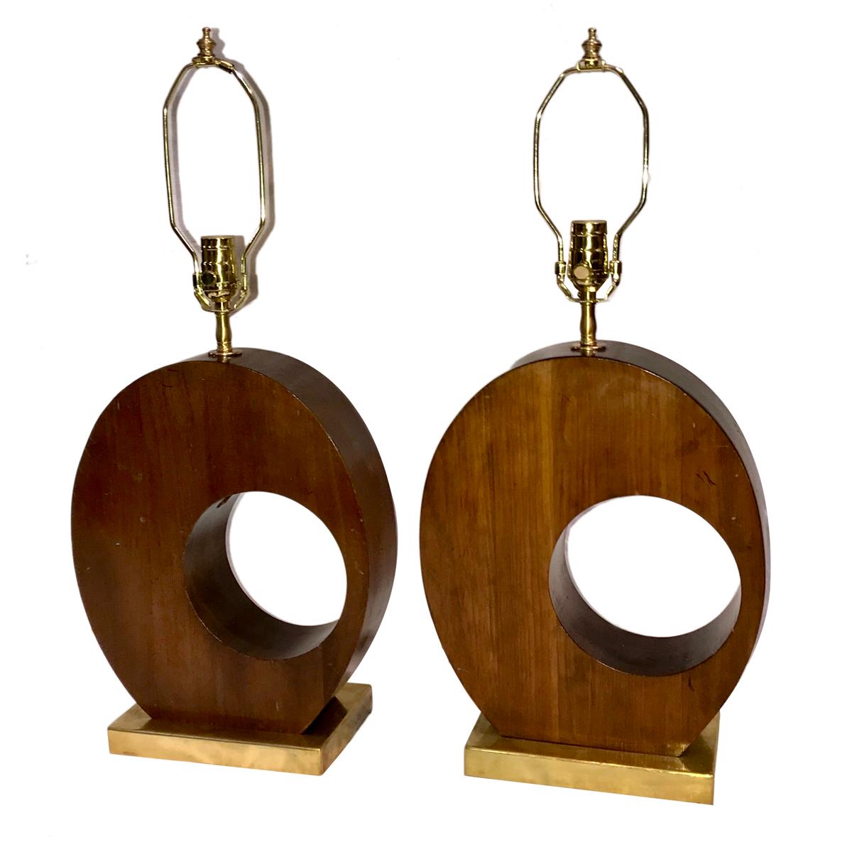 A pair of circa 1950s French Moderne carved wood sculptural lamps with gilt bases.

Measurements:
Height 15