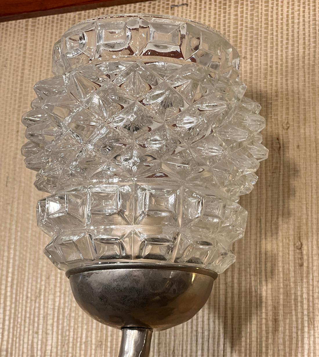 Pair of 1940's French nickel-plated sconces with molded glass globes Bodies shaped as branches. 
measurements:
Height: 14