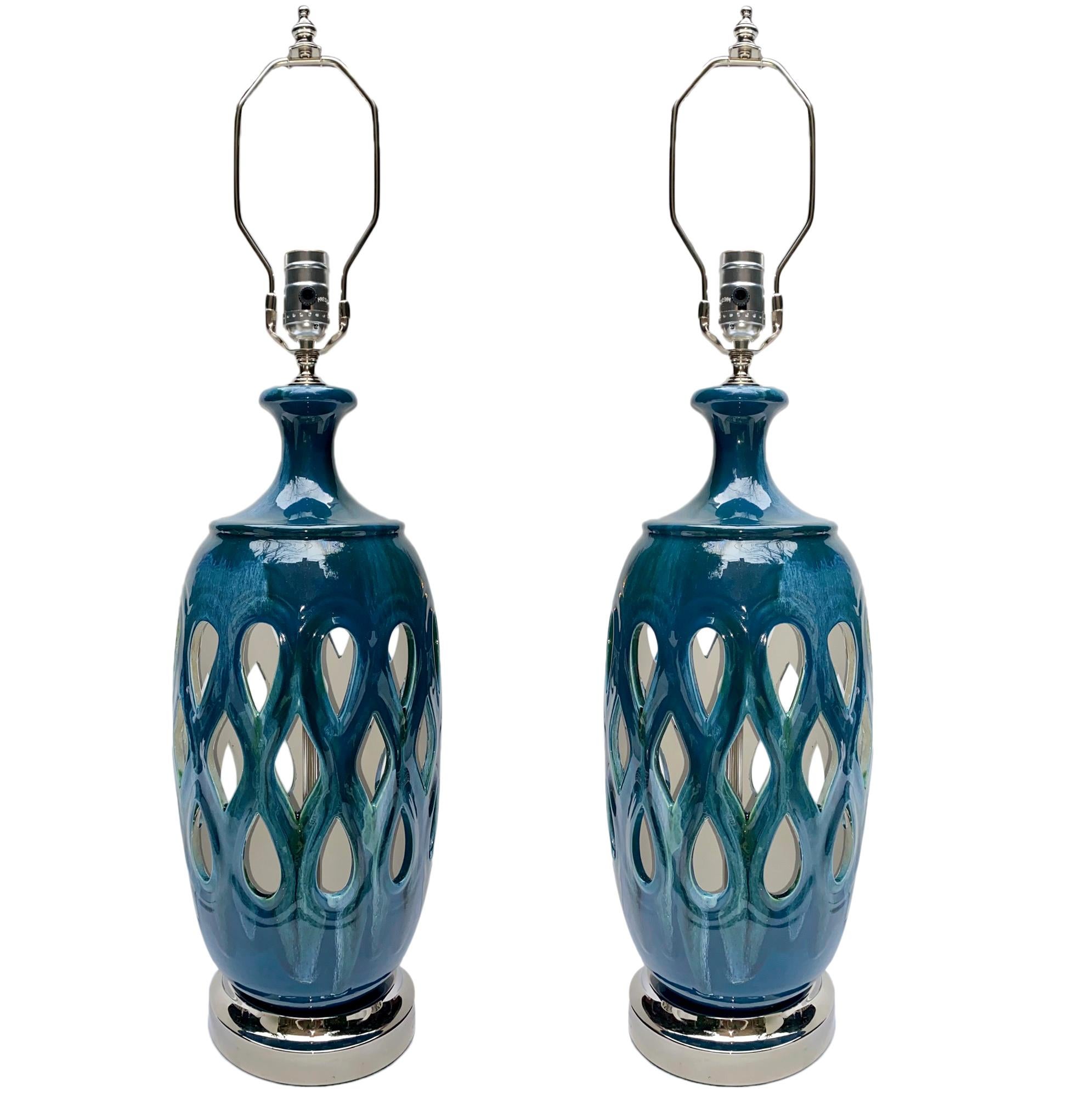 Pair of Italian 1950's blue porcelain lamps with silver plated bases.

Measurements:
Height of body: 19