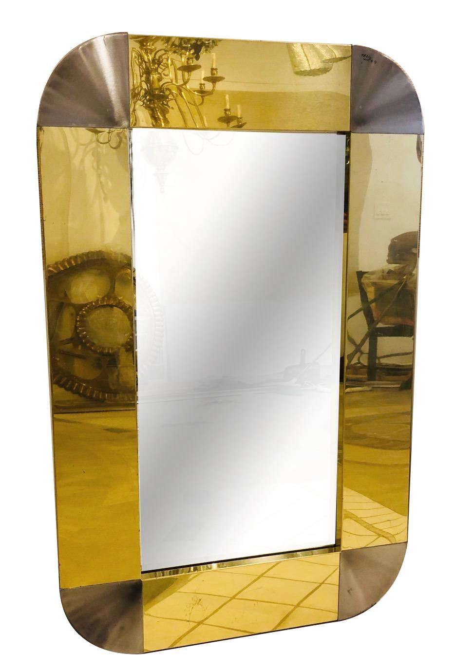 Paire de miroirs C. Jere' 1983 en laiton poli et cadre en métal argenté. Vendu par paire.

Mesures :
Hauteur : 44
Largeur : 28