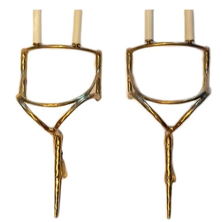 Pair of French circa 1950's Moderne style two-light bronze sconces with shades.

Measurements:
Height: 22