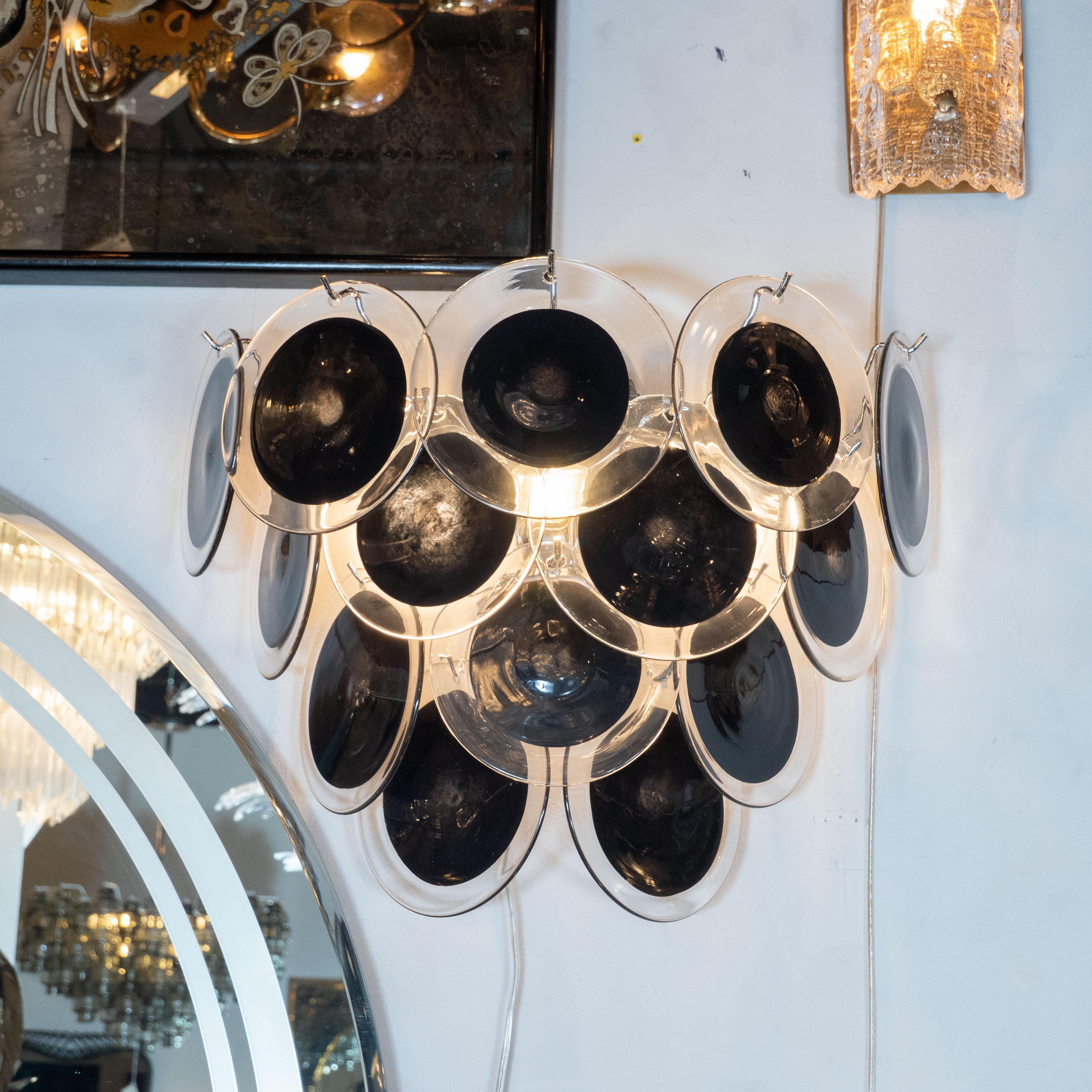 This beautiful pair of modernist 14-disc vistosi sconces were made exclusively for High Style Deco by our atelier in Murano, Italy- the island off the coast of Venice, renowned for centuries for its superlative glass production. Realized in the