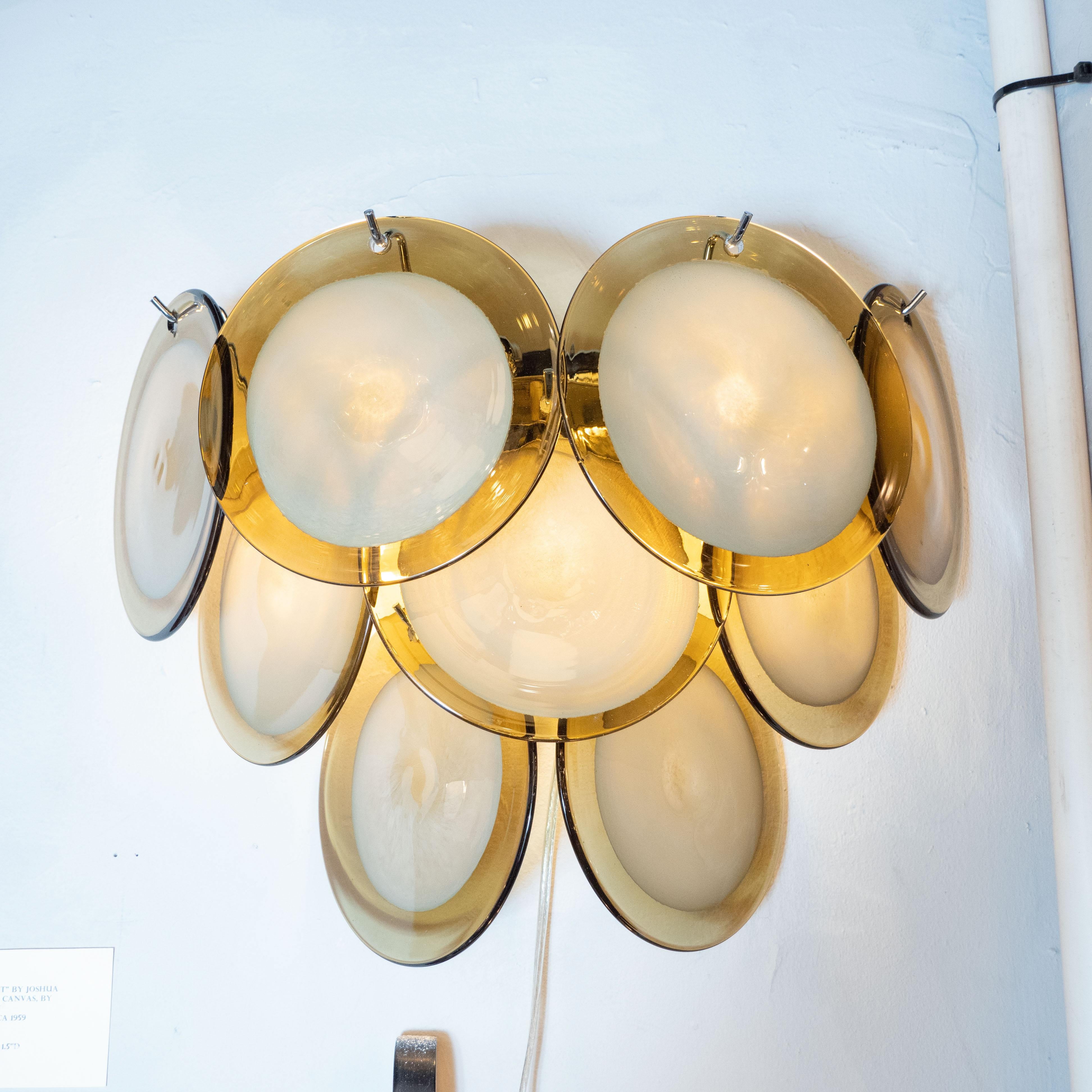 This beautiful pair of modernist 9-disc vistosi sconces were made exclusively for High Style Deco by our atelier in Murano, Italy- the island off the coast of Venice, renowned for centuries for its superlative glass production. Realized in the