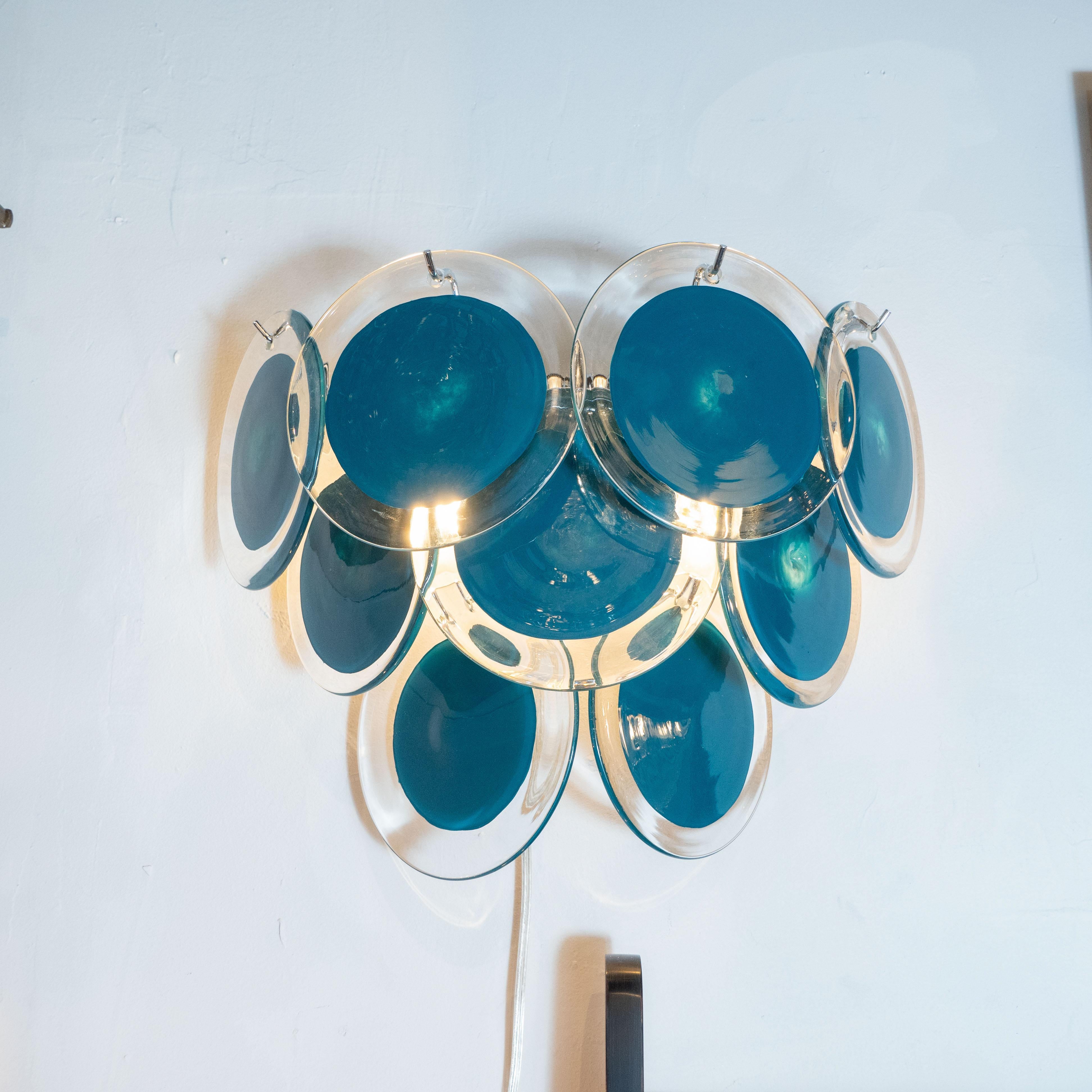 This beautiful pair of modernist 9-disc Vistosi sconces were made exclusively for high style deco by our atelier in Murano, Italy- the island off the coast of Venice, renowned for centuries for its superlative glass production. Realized in the