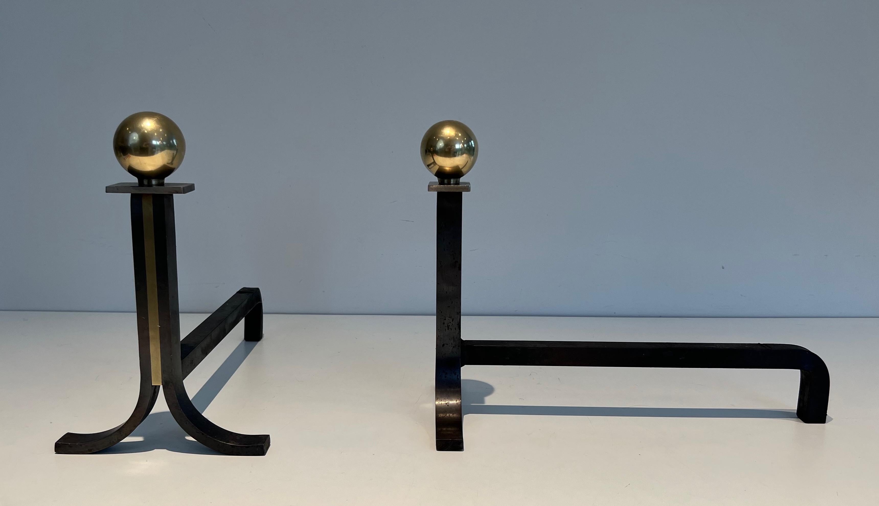 Mid-20th Century Pair of Modernist Andirons in the Style of Jacques Adnet For Sale