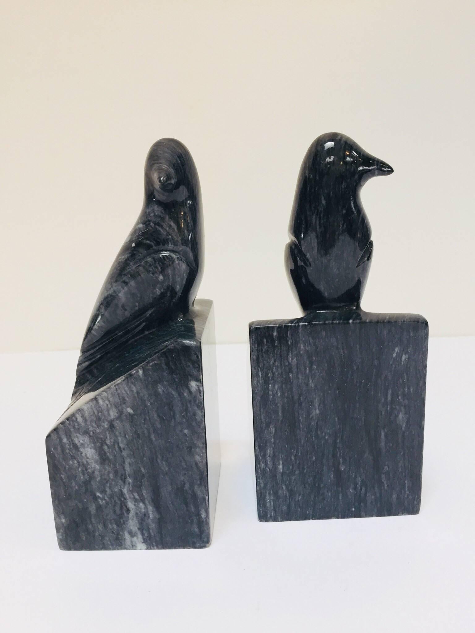 Pair of black marble birds perched on a pillar bookends.
This sleek little birds will add a very natural organic note to any modern or classic interior.
Great hand carved birds with color in shades of black and grey.
Art Deco style book ends made in
