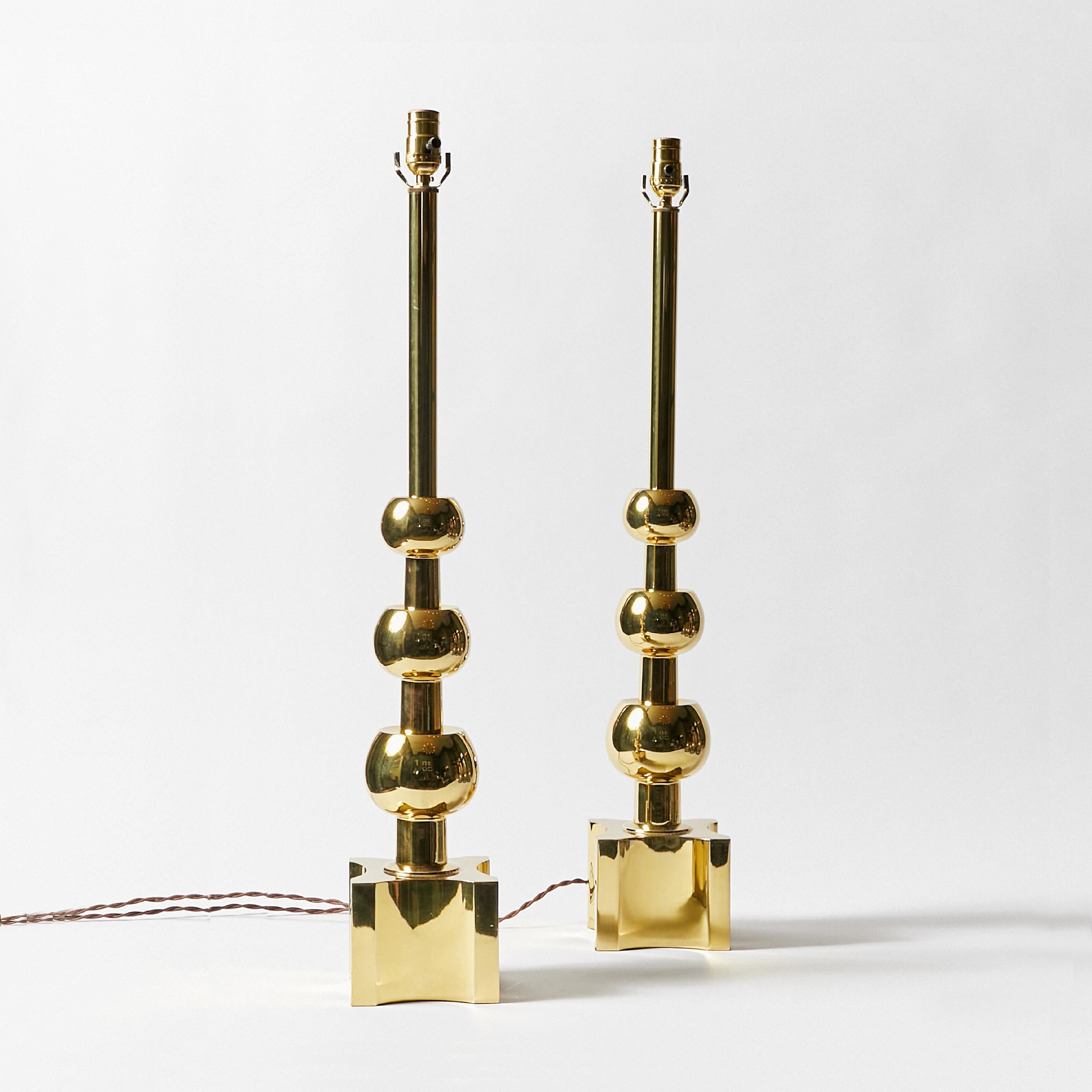 Set of two brass ball lamps mid-century modern by Tommi Parzinger for Stiffel Lamp Co. This item has been rewired with braided cloth cord and new hardware. This lamp does not include shade or harp.
