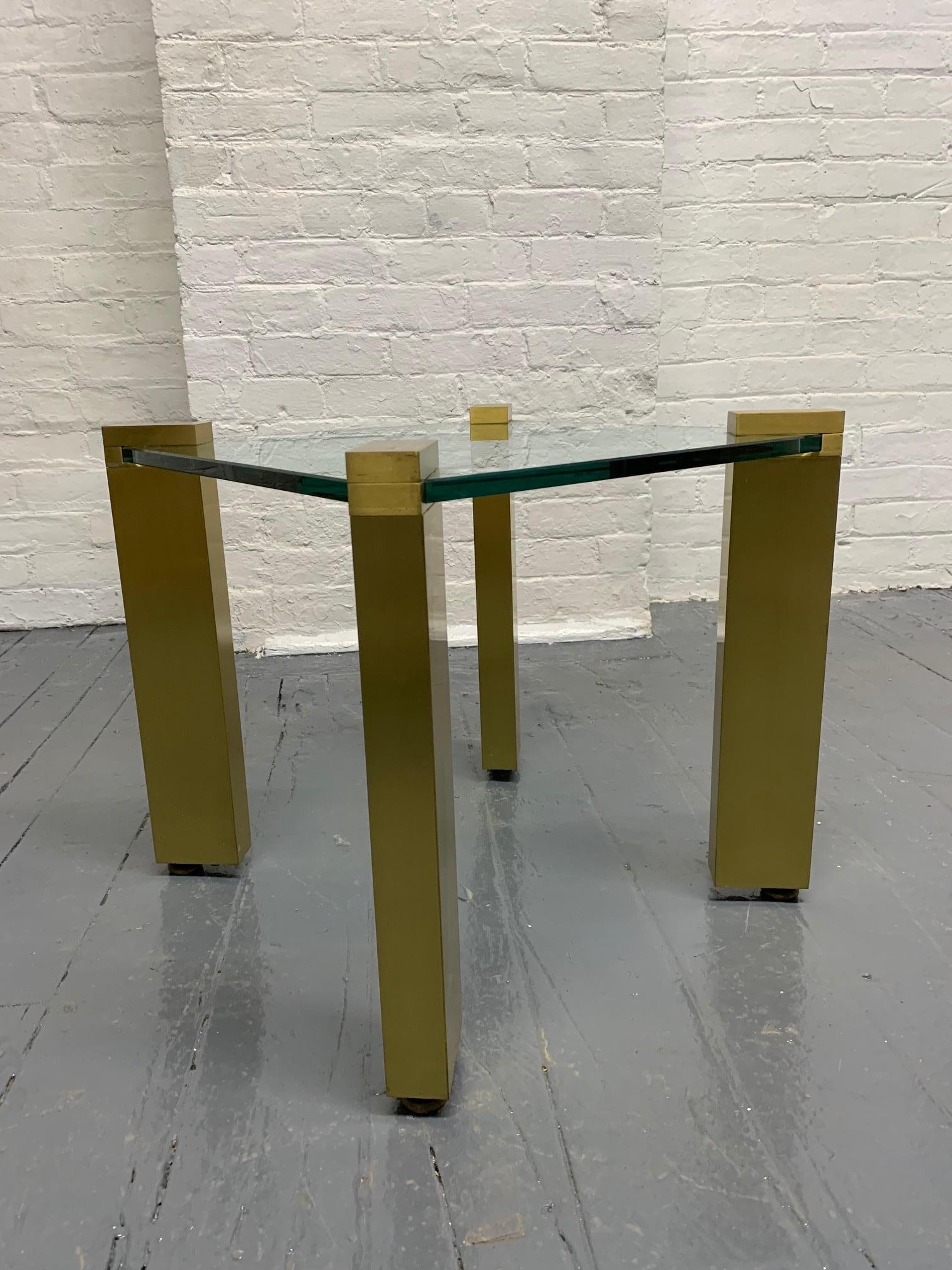 Pair of modernist brass side tables with glass tops. Maison Jansen style.

  