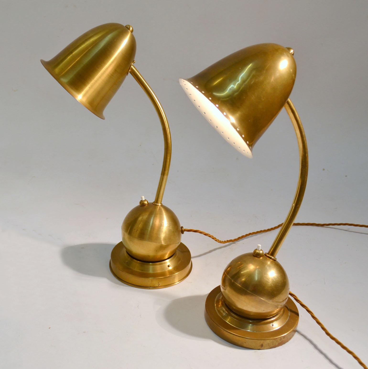 Modernist brass counterbalance table or desk lamps by Daalderop, Giso Holland, 1930s. One is decorated in a ring of perforations around the shade which are rare with these lamps. The lamps are fully adjustable in any position working with gravity
