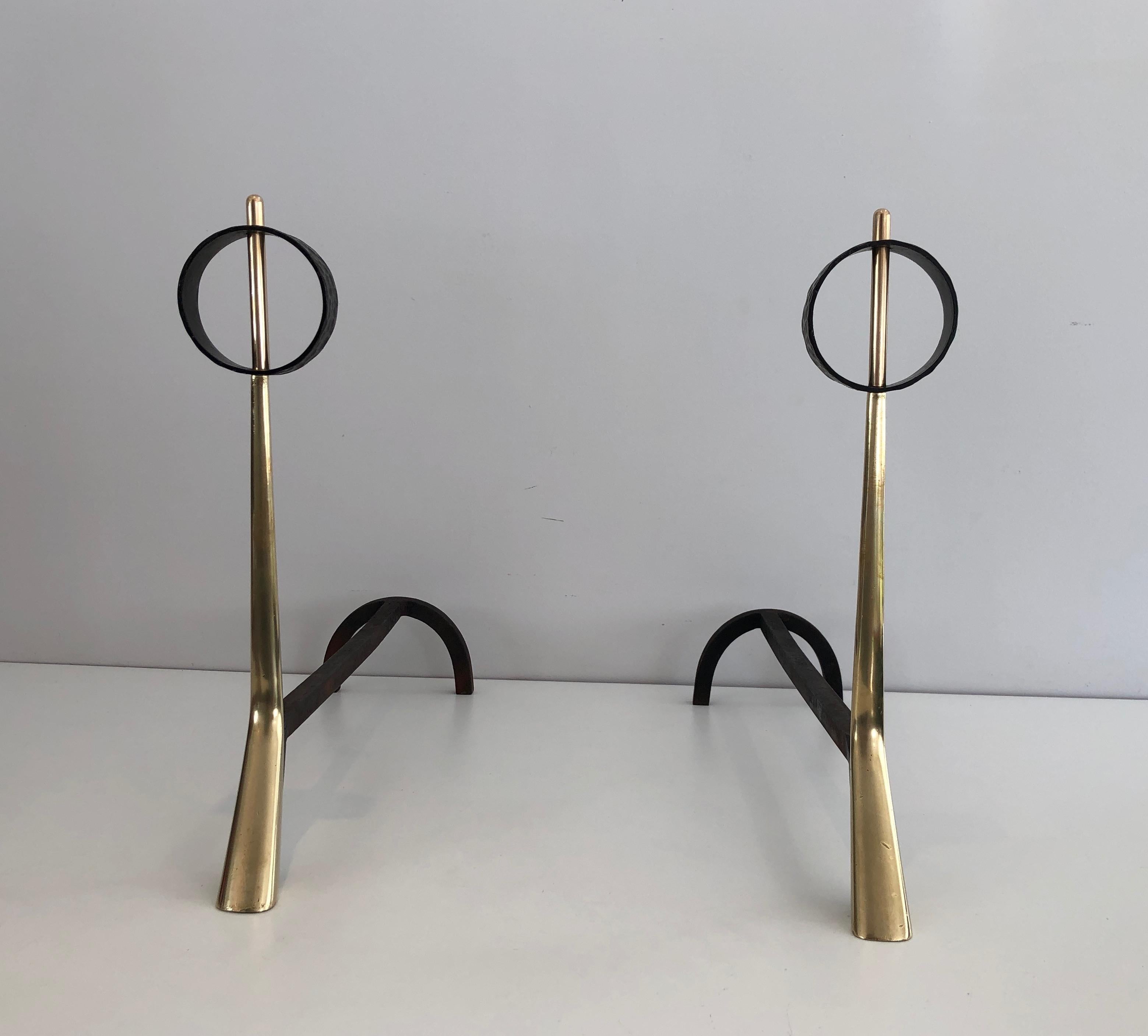 This very nice pair of modernist andirons is made of bronze and wrought iron andirons. This is a very interesting Italian design, circa 1950.