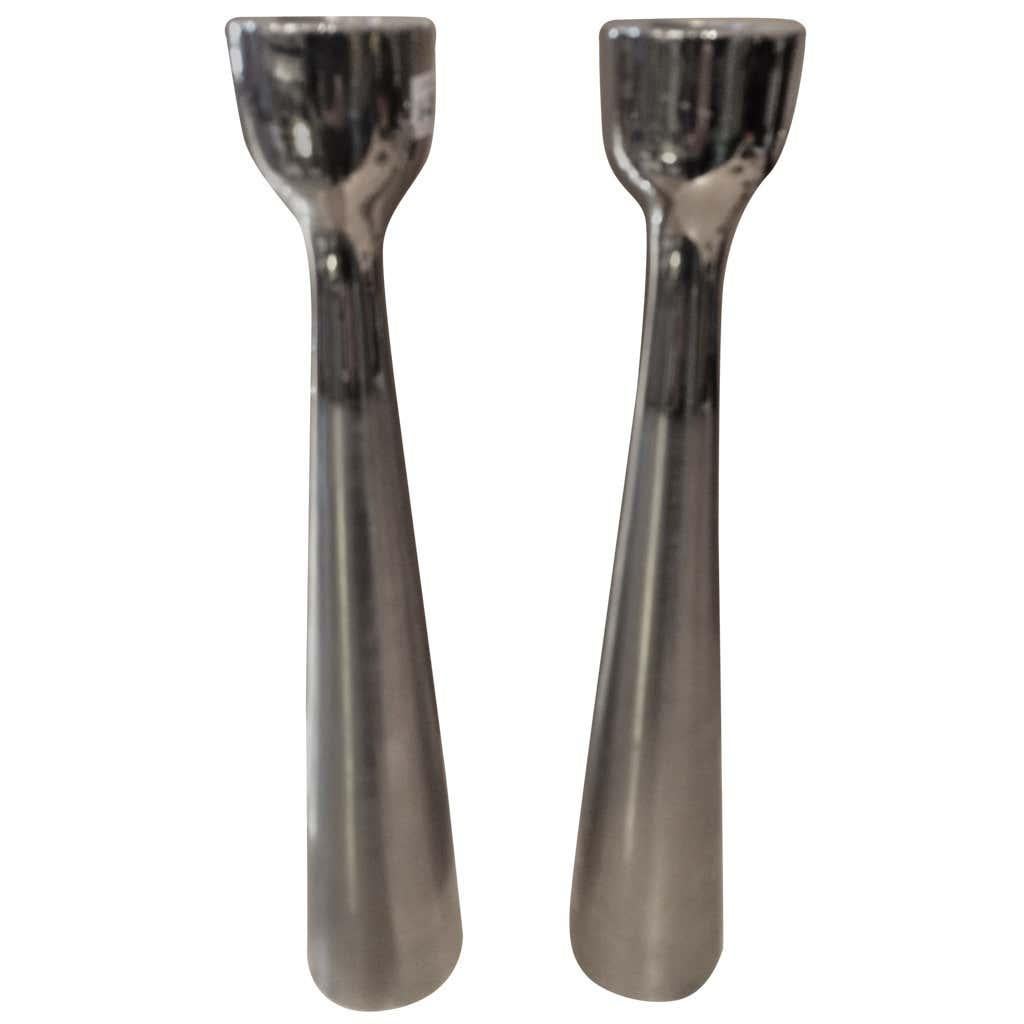 Pair of modernist candleholders. Heavy, solid pair. Great design. Danish design/influence. Two-toned: Polished top with matte bottom. Hollow interior. Price is per pair