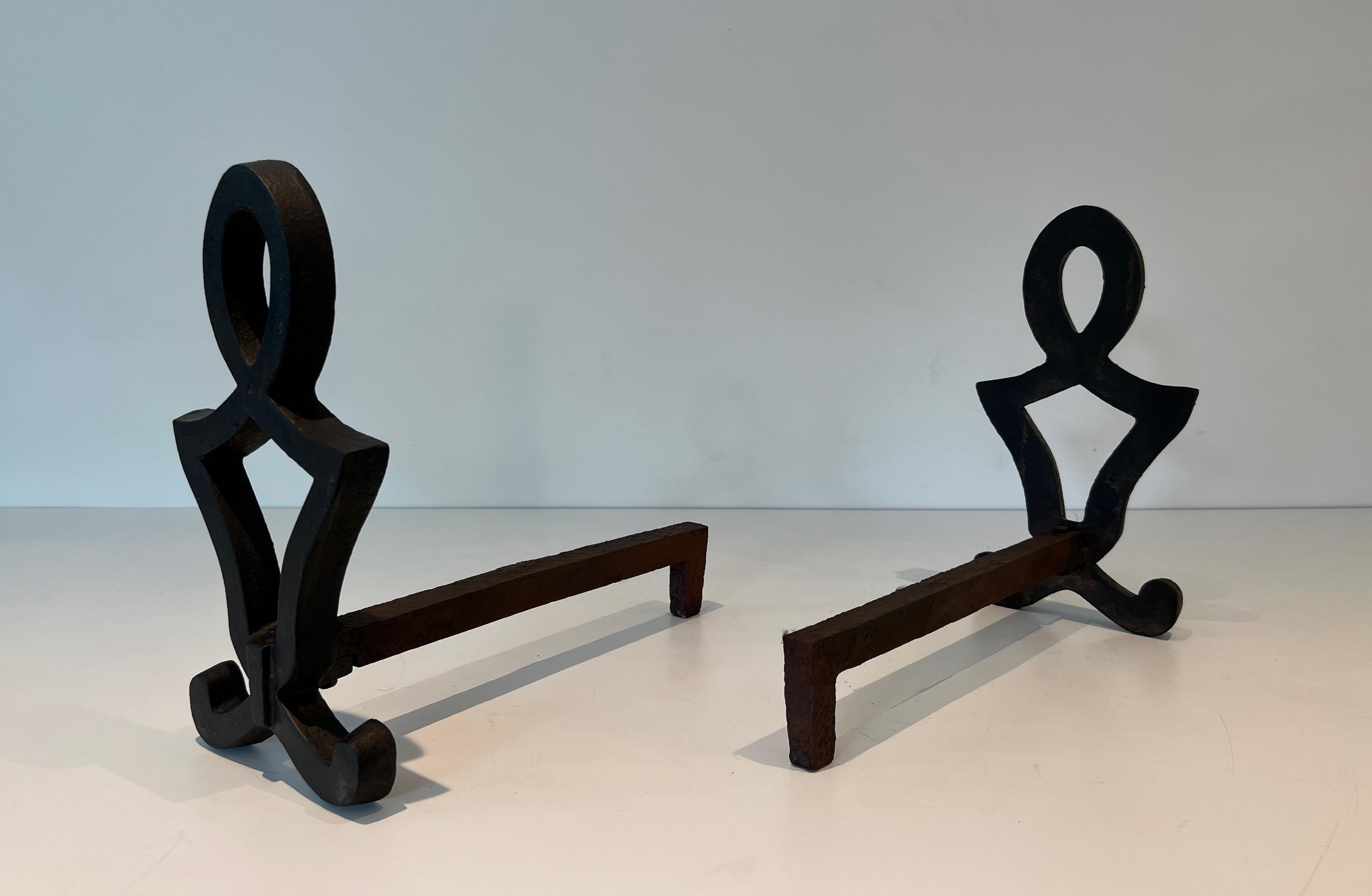 Mid-20th Century Pair of Modernist Cast Iron and Wrought Iron Andirons by Raymond Subes For Sale