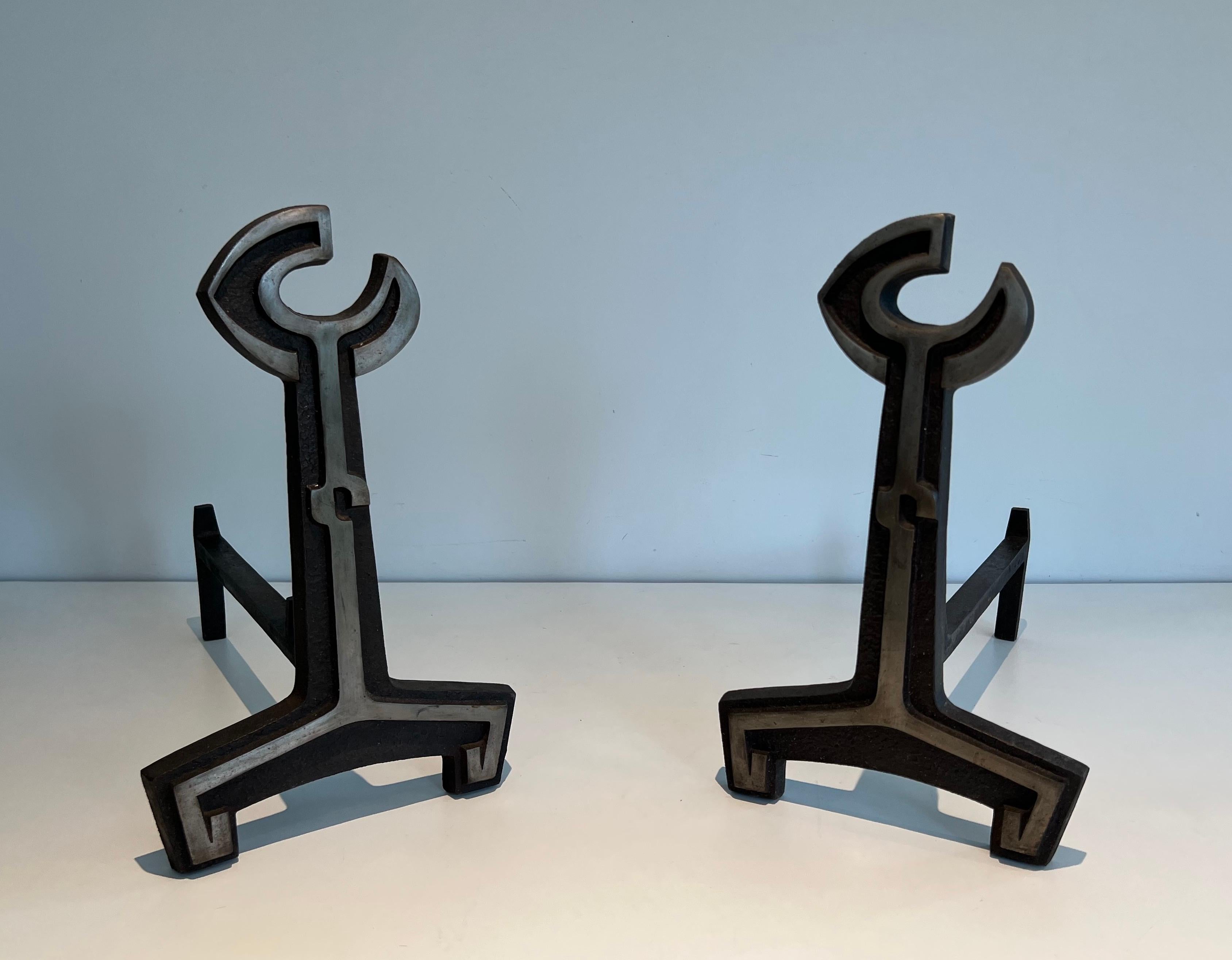 This pair of andirosn is made of cast Iron and wrought Iron. This is a French work. Circa 1950.