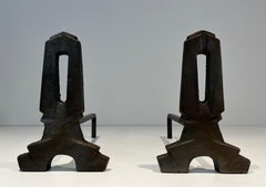 Pair of modernist cast iron and wrought iron andirons. French work. Circa 1940