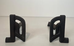 Pair of modernist cast iron and wrought iron andirons. French work. Circa 1940