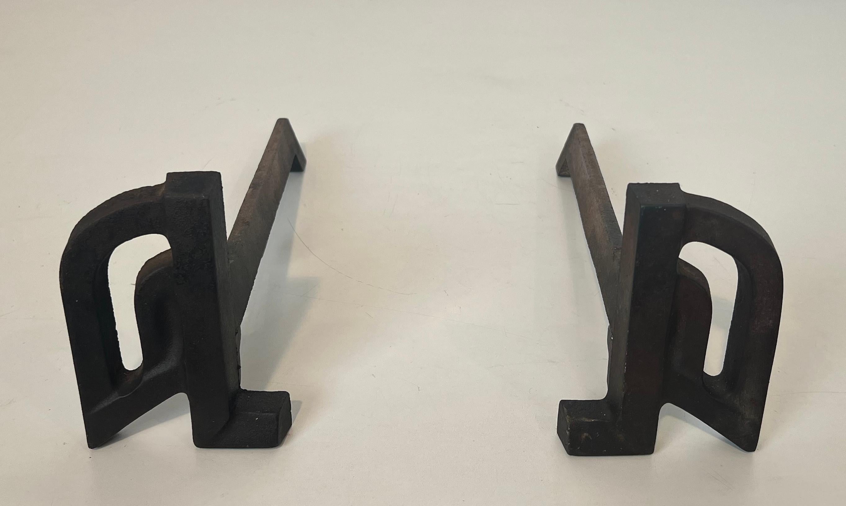 Mid-Century Modern Pair of modernist cast iron and wrought iron andirons. French work. Circa 1940 For Sale