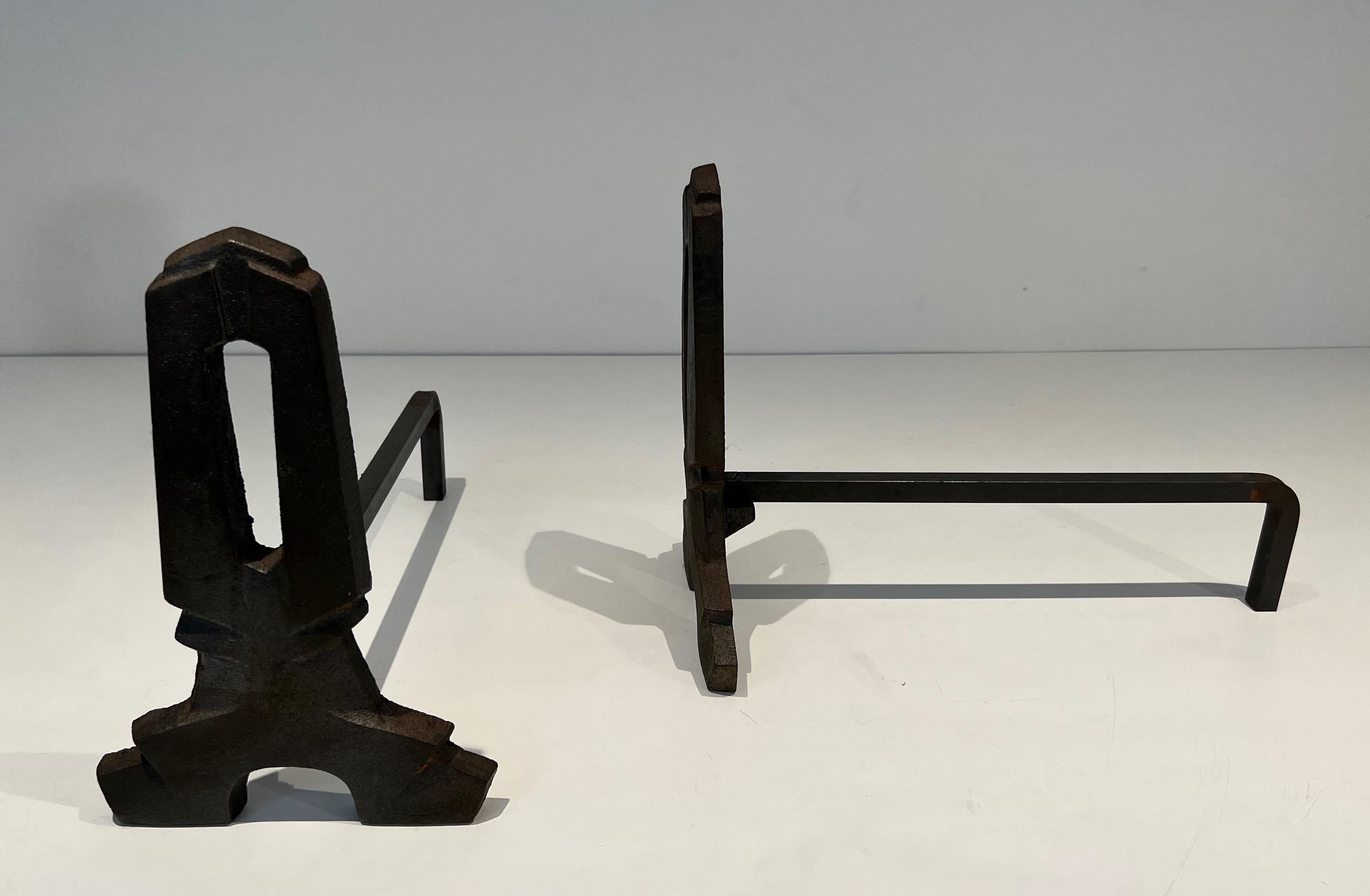 Mid-20th Century Pair of modernist cast iron and wrought iron andirons. French work. Circa 1940 For Sale