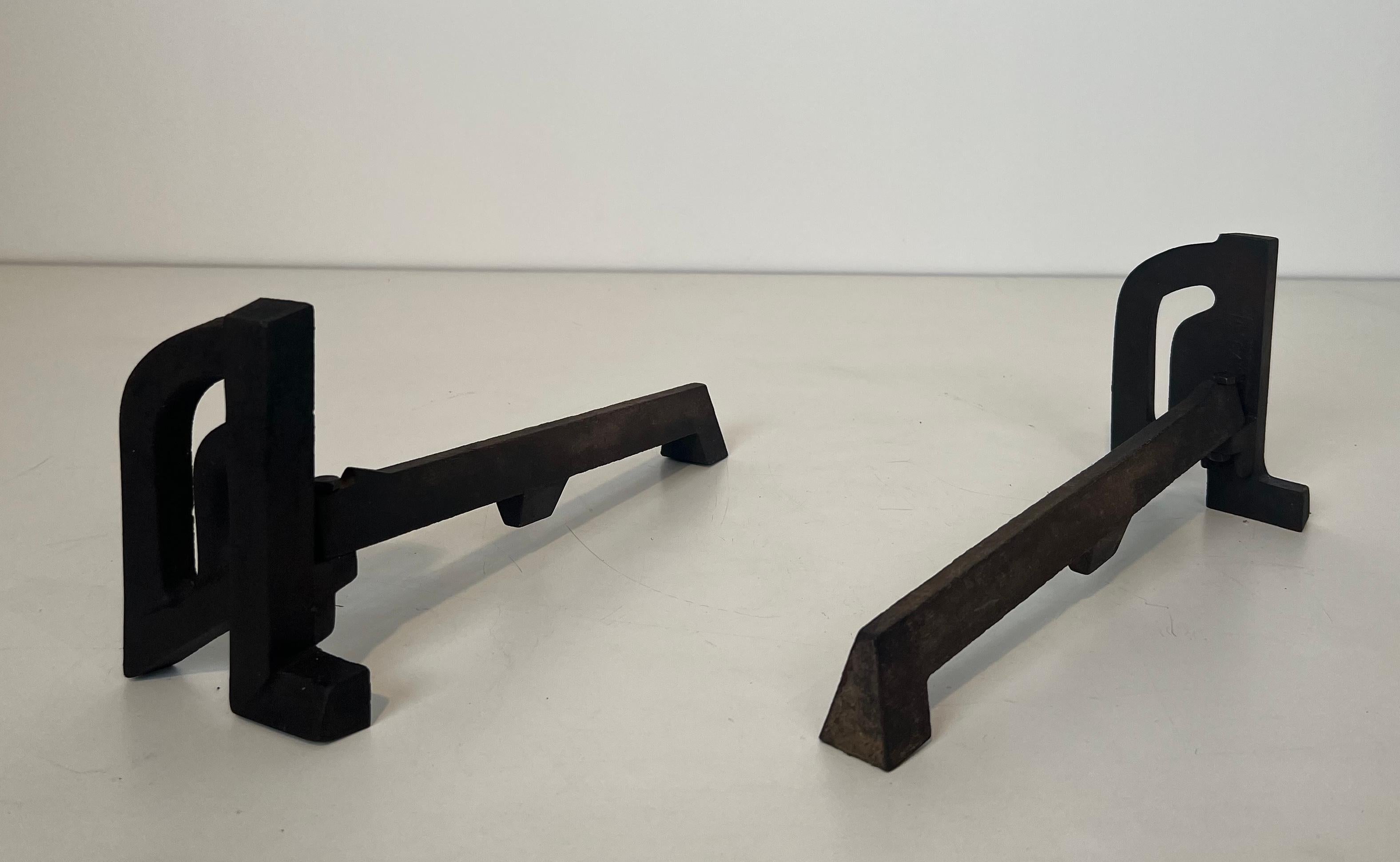 Mid-20th Century Pair of modernist cast iron and wrought iron andirons. French work. Circa 1940 For Sale