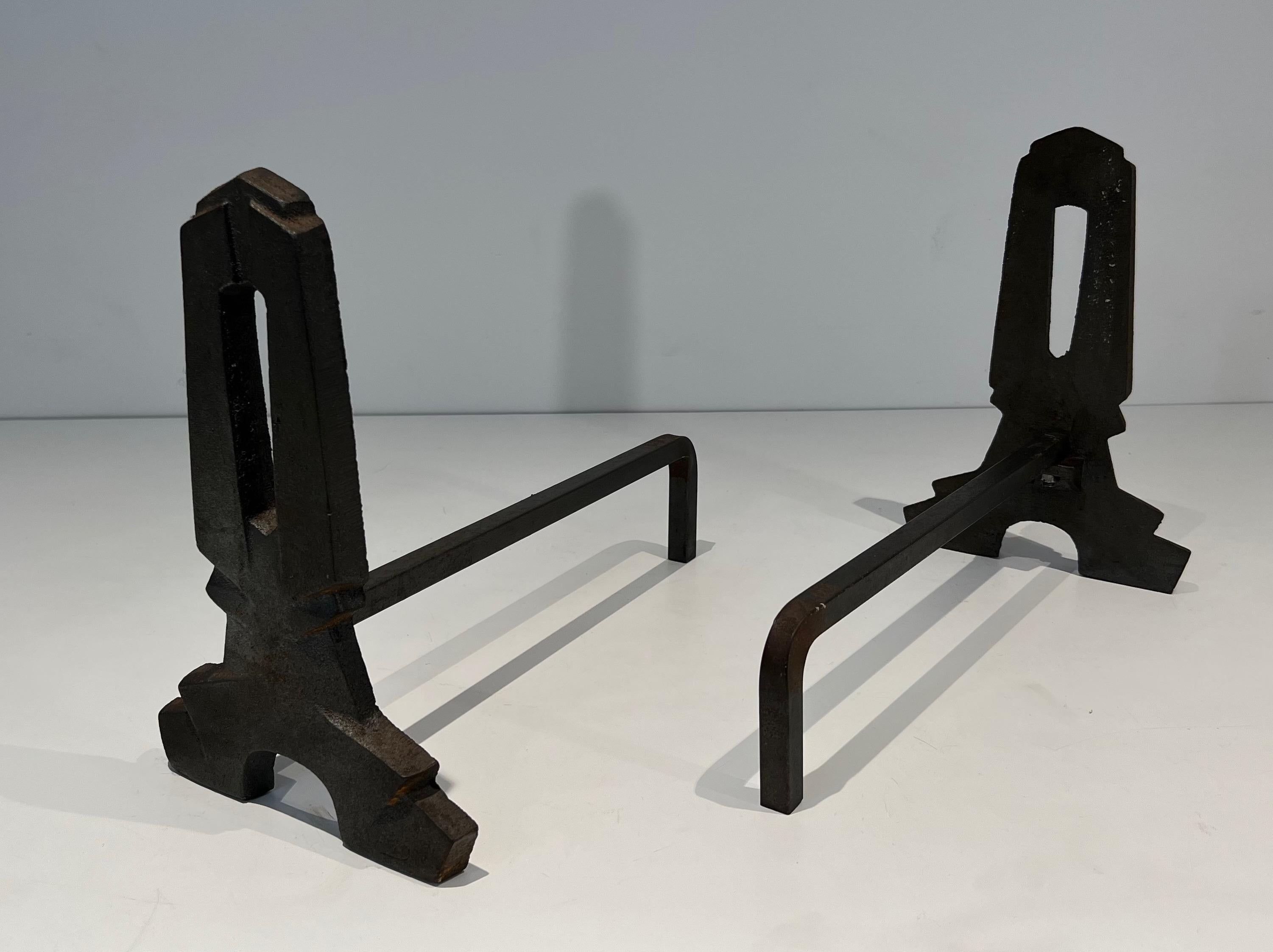 Iron Pair of modernist cast iron and wrought iron andirons. French work. Circa 1940 For Sale