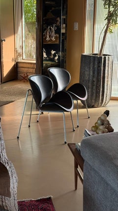 Pair of modernist chrome and pleather chairs, 20th century