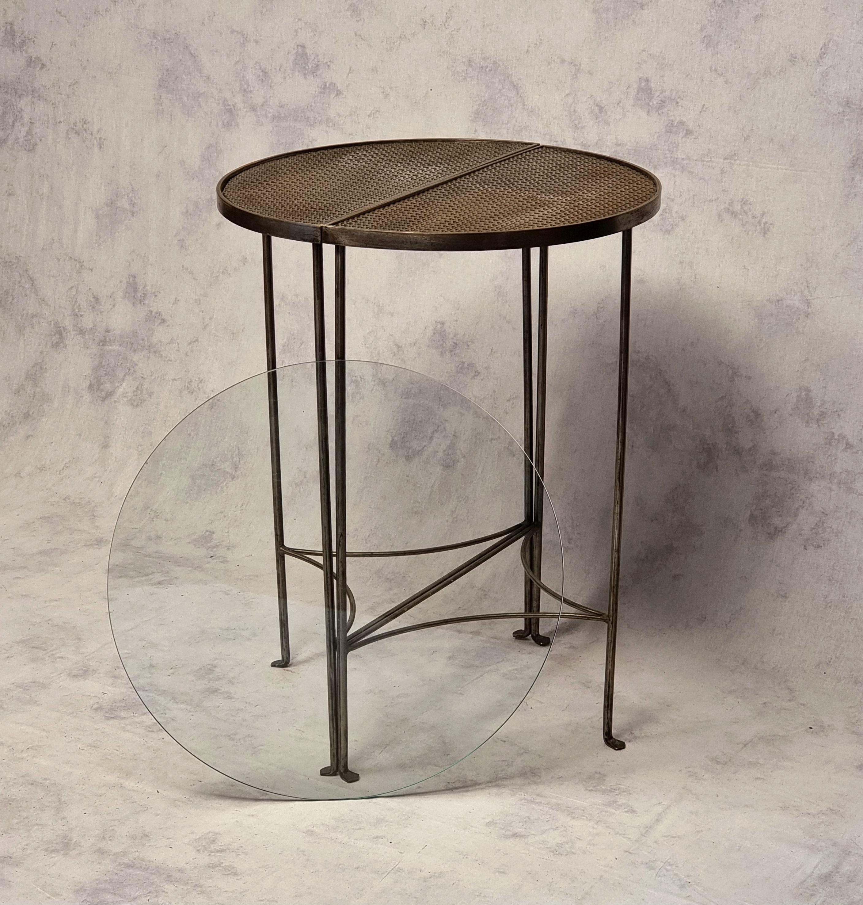 Pair of modernist style half-moon consoles forming a wrought iron pedestal table. Original and modular piece allowing these pieces to be presented separately in a half-moon console or joined together in a circular pedestal table. Pretty structure in