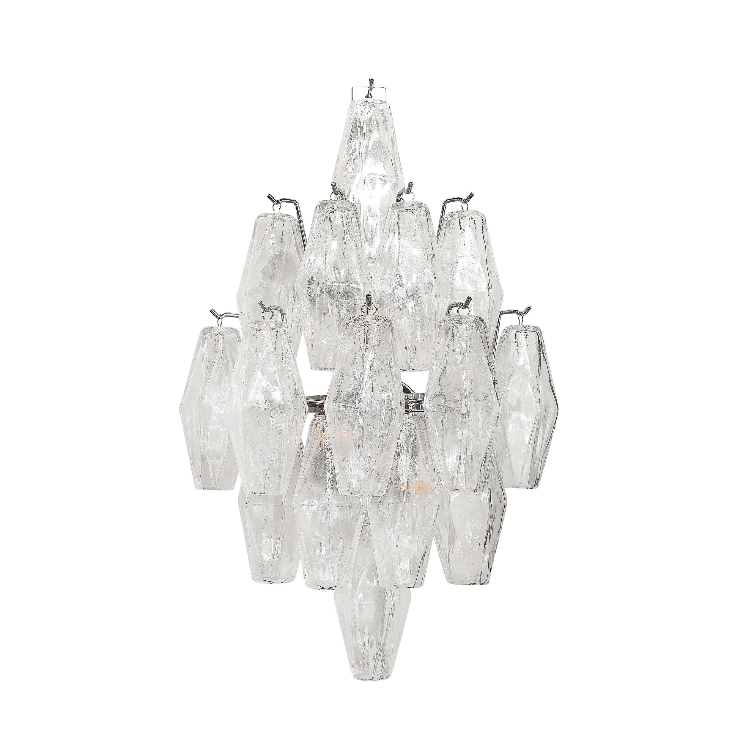 This beautifully elegant Pair of Modernist Hand-Blown Murano Glass Diamond Form Polyhedral Sconces W/Chrome Fittings originates from Italy during the later half of the 20th Century. They feature a geometric composition of transparent hand-blown