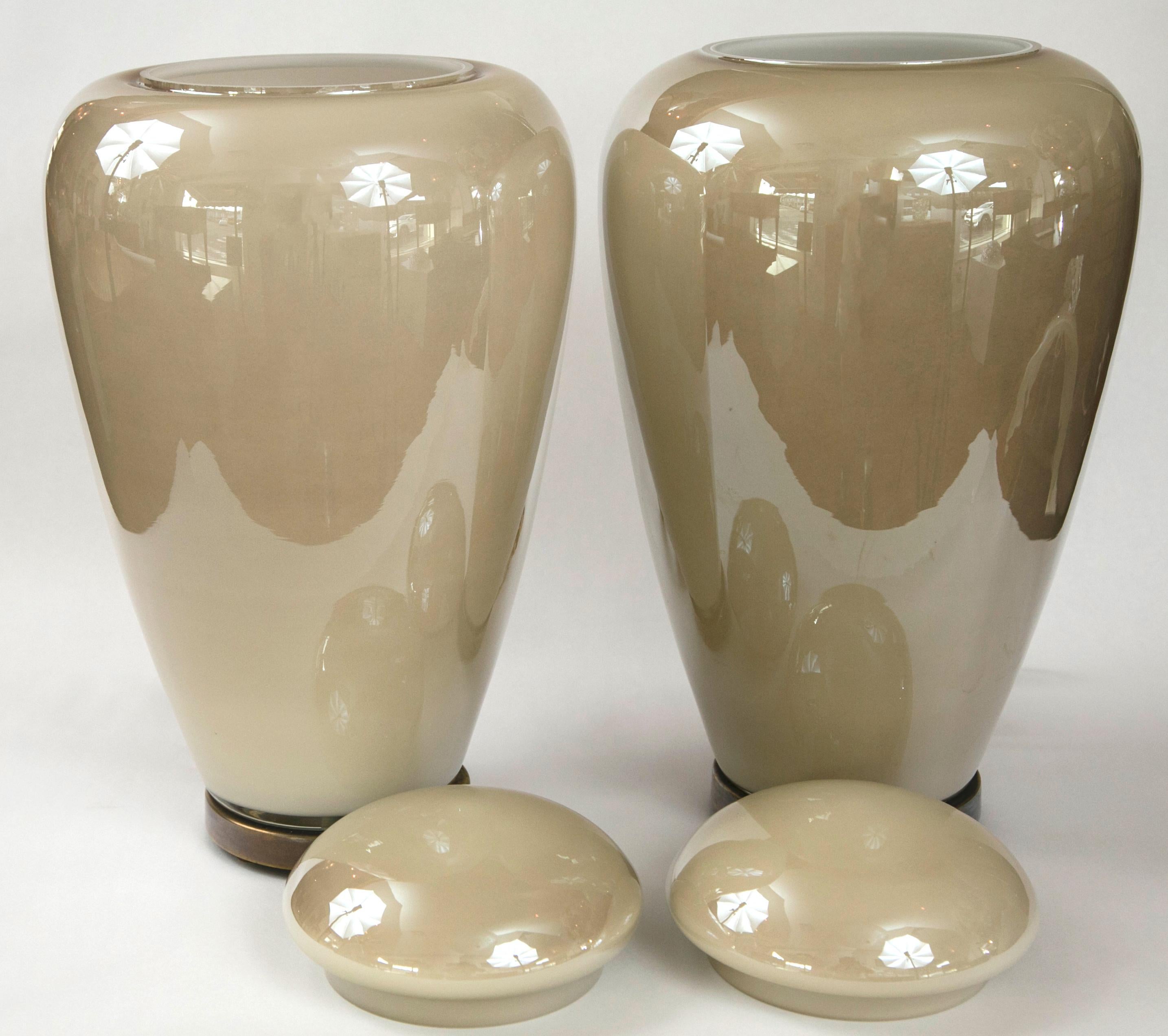 Pair of covered vases with brass bases in a silky soft toned creme/taupe  color
illuminated with one socket for up to 40 watts - for an amazing effect!
Origin: Venice, Italy
Dimensions of glass:
15 1/2