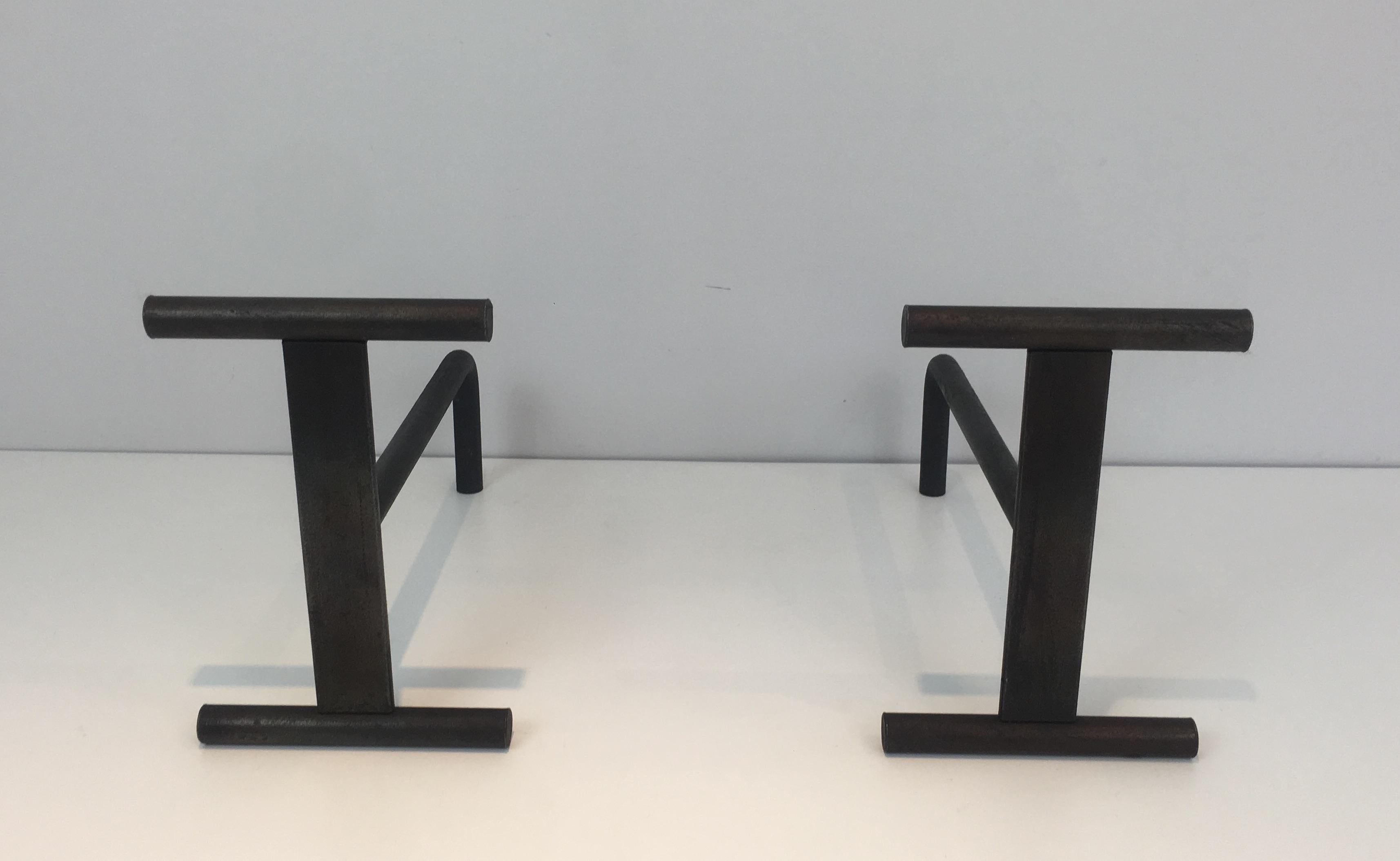 This pair of modernist andirons are made of Iron. They have a very simple design. They are French, circa 1970.