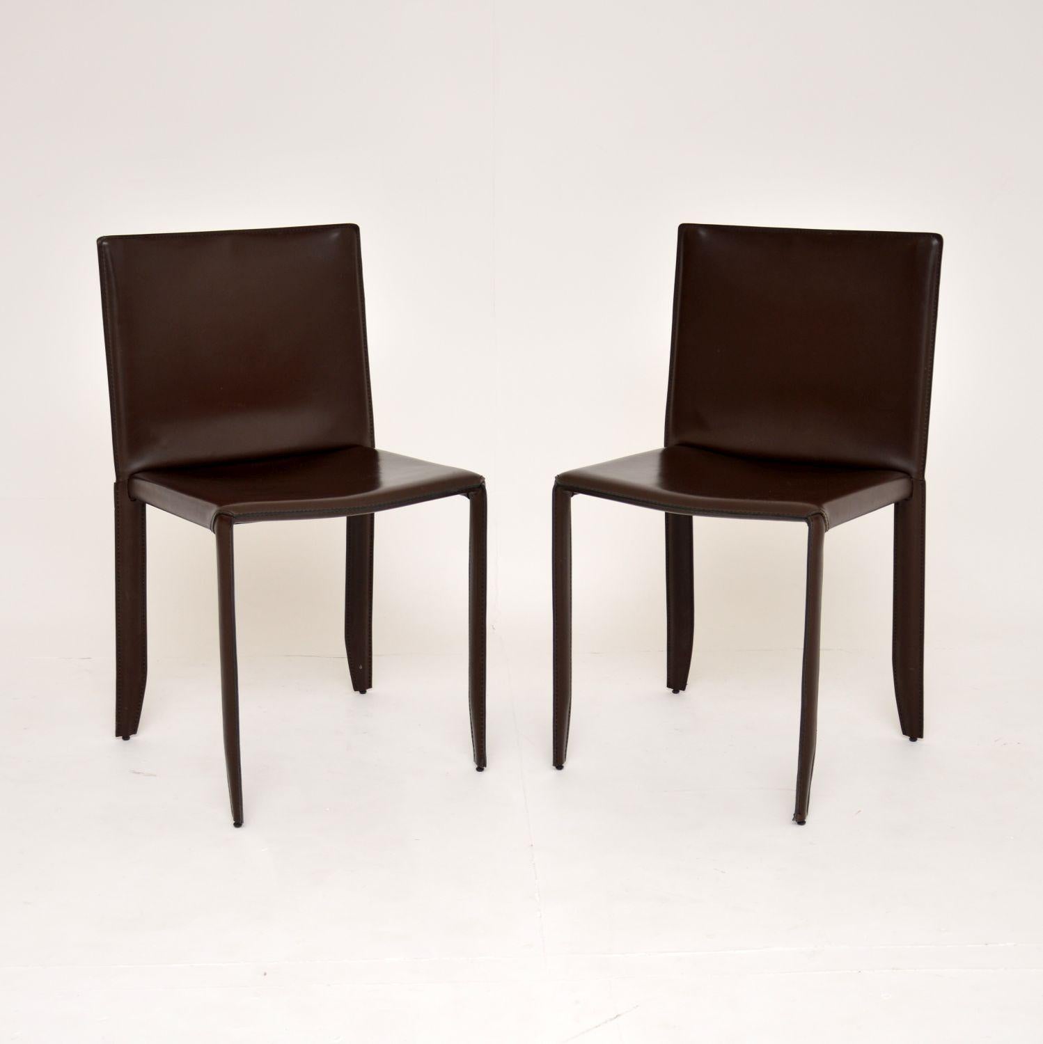 A stylish and extremely fine quality pair of modernist side chairs in leather. These were made in the late 20th/early 21st century by Catellan Italia.

Very expensive to buy new, this slightly older pair are beautifully made with steel frames