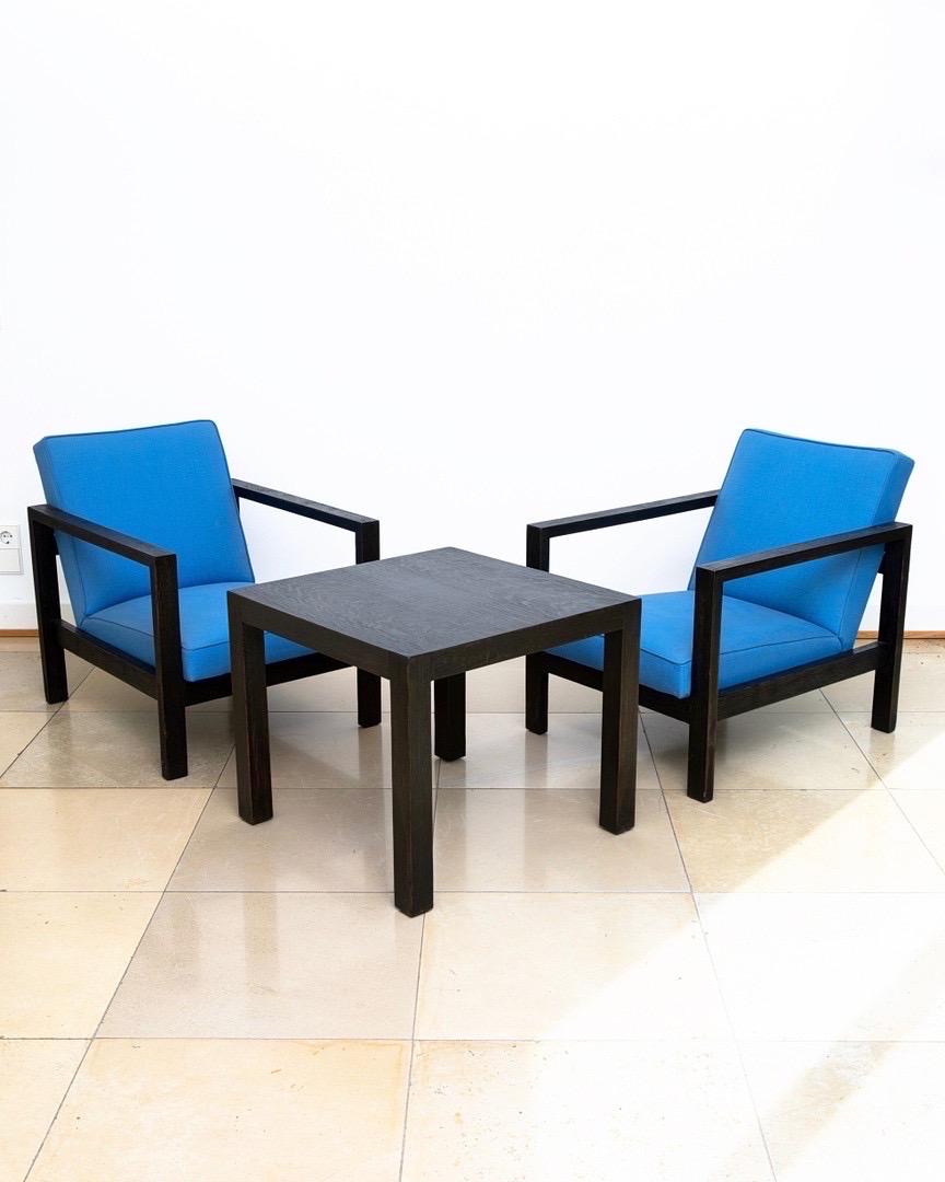 Discover the Timeless Elegance of Huib Hoste's Modernist Lounge Set: 2 Easy Chairs + Coffee Table

Experience the allure of Huib Hoste's Modernist Lounge Set, consisting of two easy chairs and a coffee table. This exceptional seating group, designed