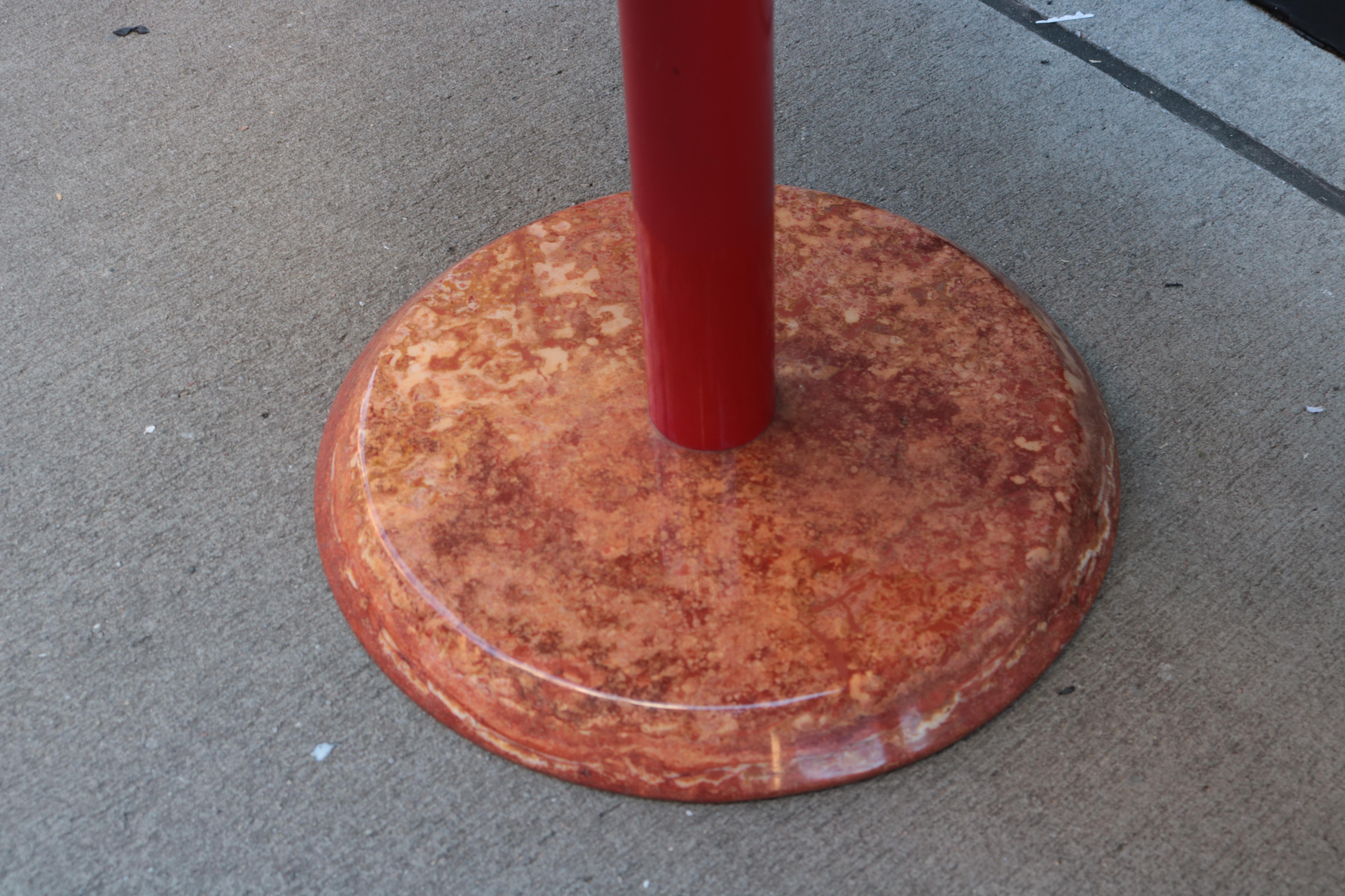 A pair of modernist marble side tables.
Marble tops and bases with
red metal support column.
Farturing original labels: Cattelan Italia.

Measures: Table 1: Heigth19½, diameter 23 inches.
Table 2: Height 15½, diameter 23.