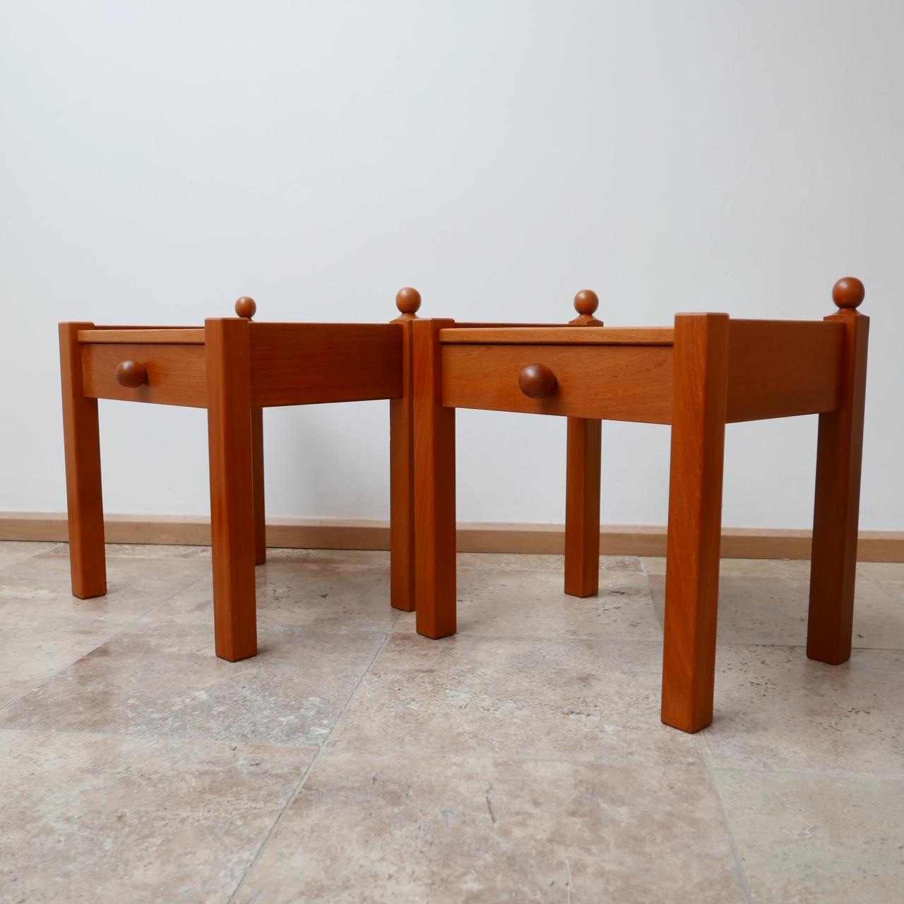 Pair of elegant bedside or side tables.

French, circa 1970s.

Stained pine.

Dimensions: 49 W x 39 D x 51 H in cm.