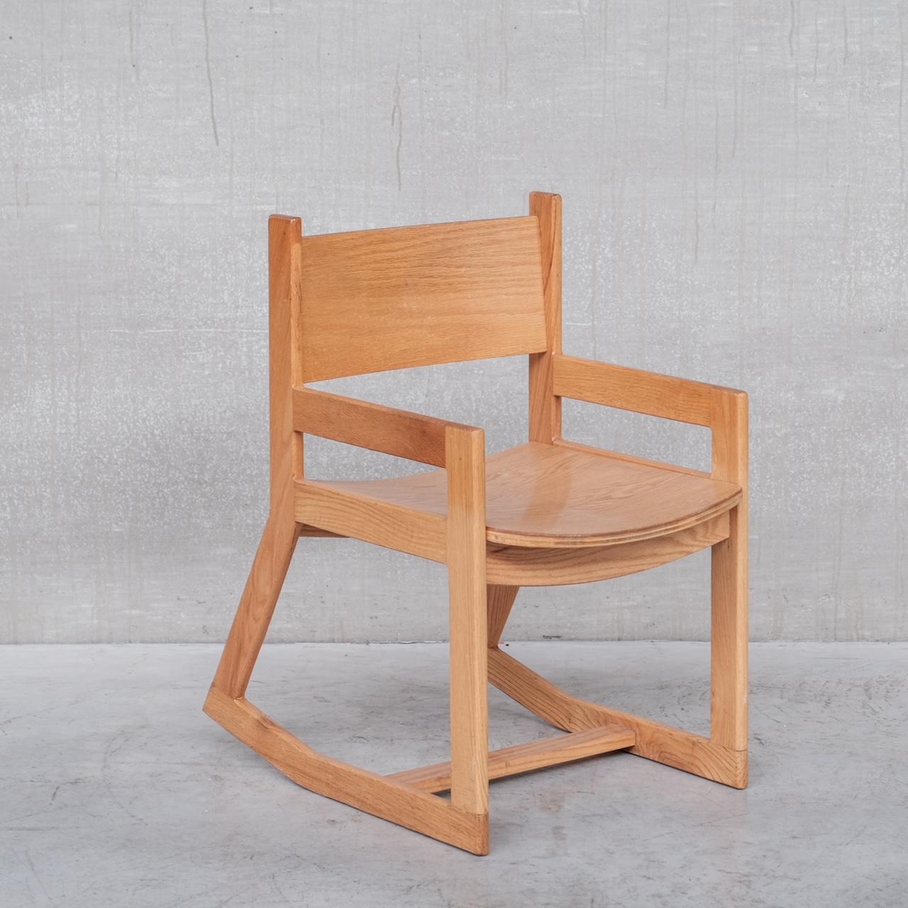 A simple but well executed modernist pair of rocking chairs. 

Holland, c1980s.

Price is for the pair. 

Good condition. 

Not an aggressive rocker angle but perfect for people who like gentle rocking on their chairs.

Location: Belgium