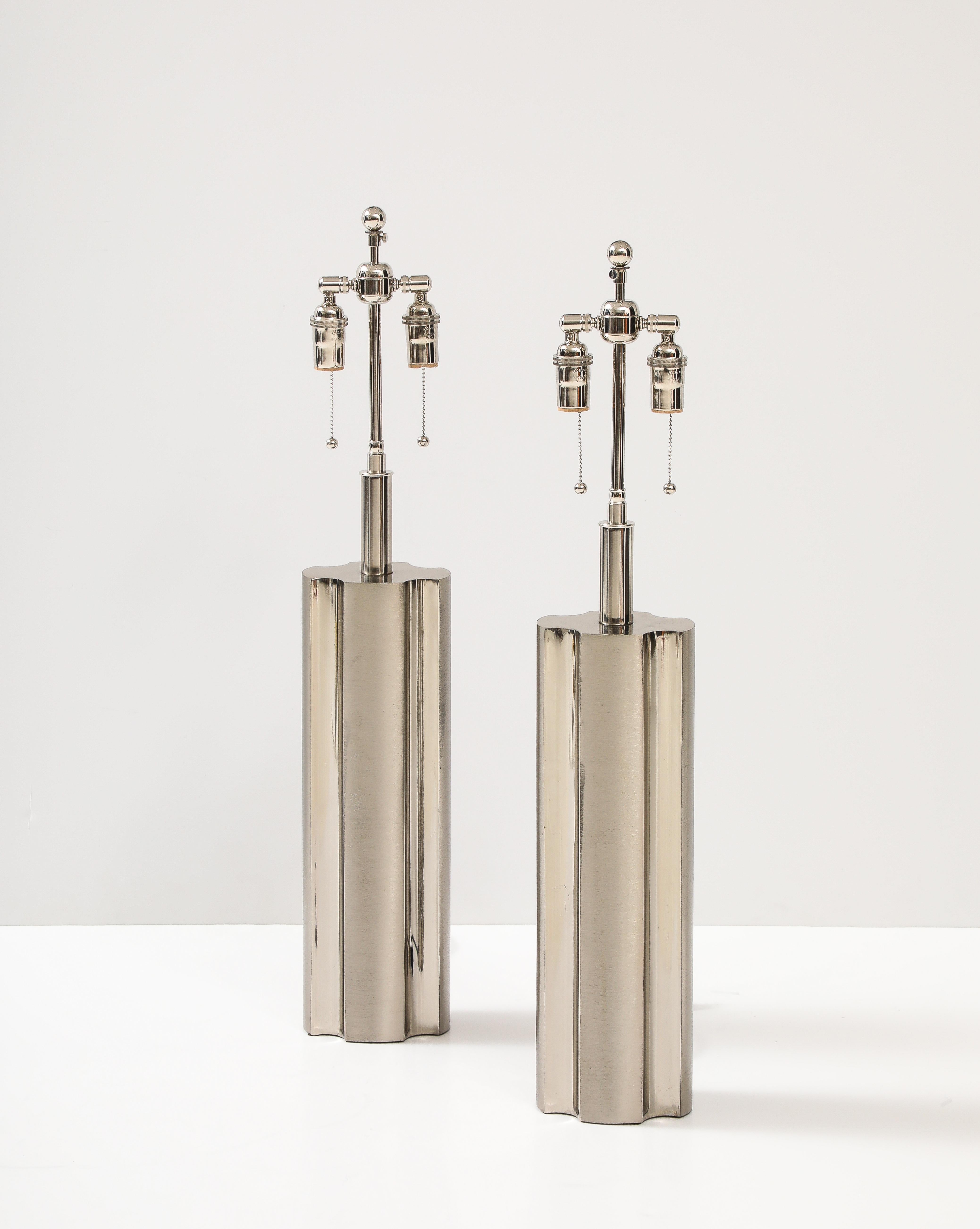 Pair of 1970's Modernist Lamps by Laurel lamp company.
The Lamps have a polished chrome and brushed finished surface.
They have been Newly rewired with adjustable double clusters and silk rayon cords and each socket has a 60 Watt maximum / 120 Watts