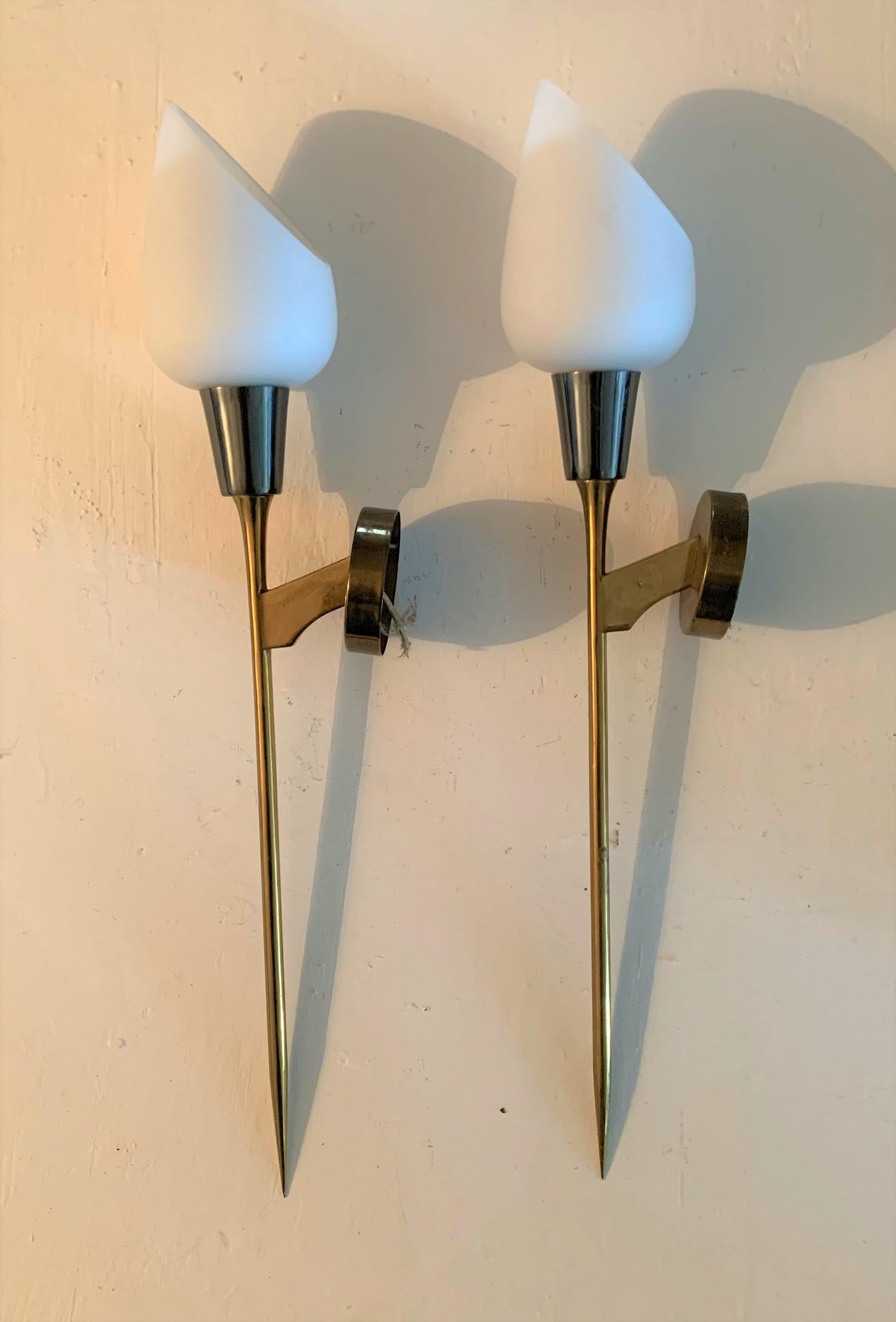 Pair of Mid-Century Modern sconces or wall lights attributed to Maison Arlus in brass, Lucite and opaline glass.
Made in France, circa 1950s.
 