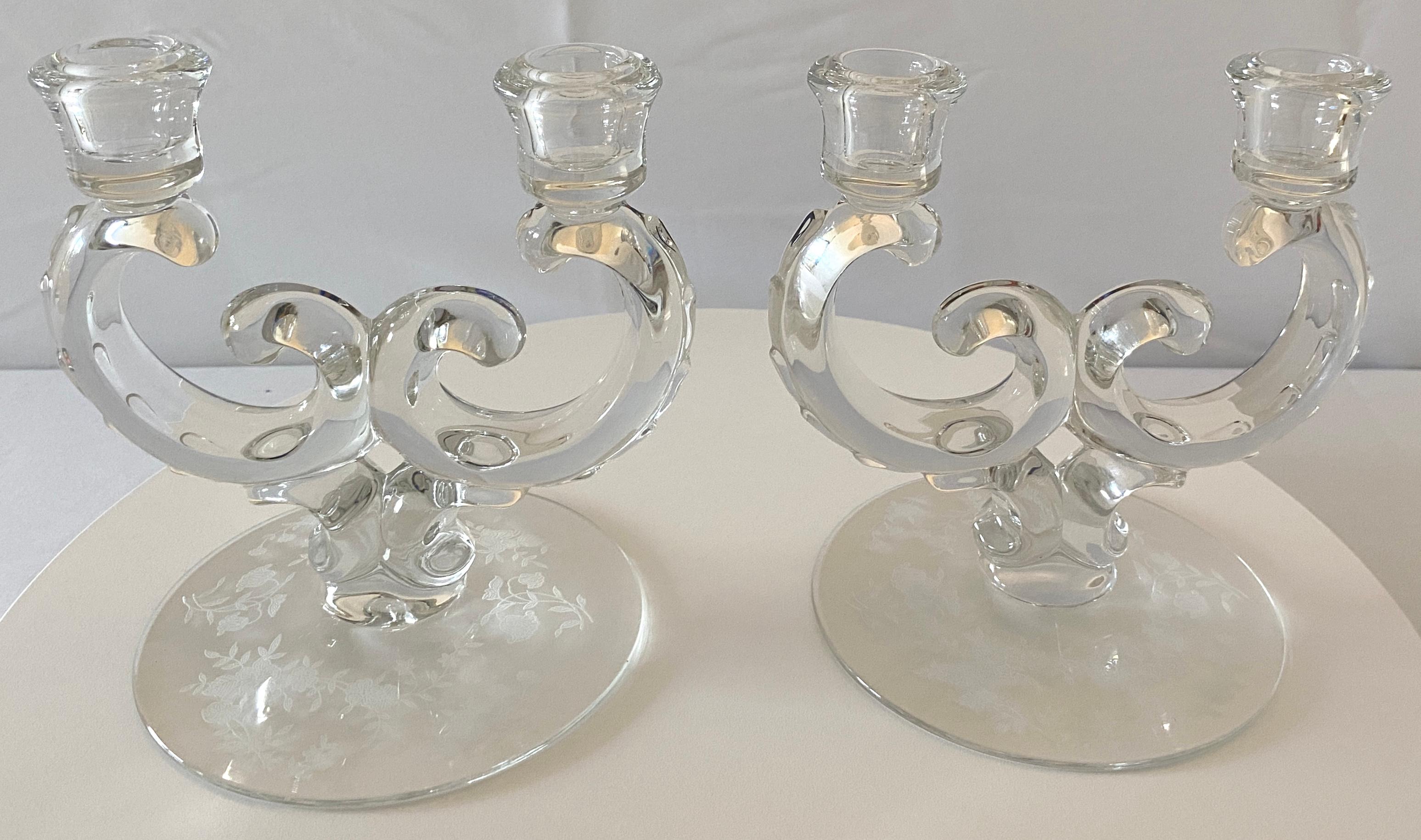 A fine quality pair of modern sculpted glass candle holders.
Eye-catching design and details. Floral etched bottoms adds a glamorous look to these sculpted glass candle holders, Italy, circa 1970.

This pair of modern sculpted glass candle holders