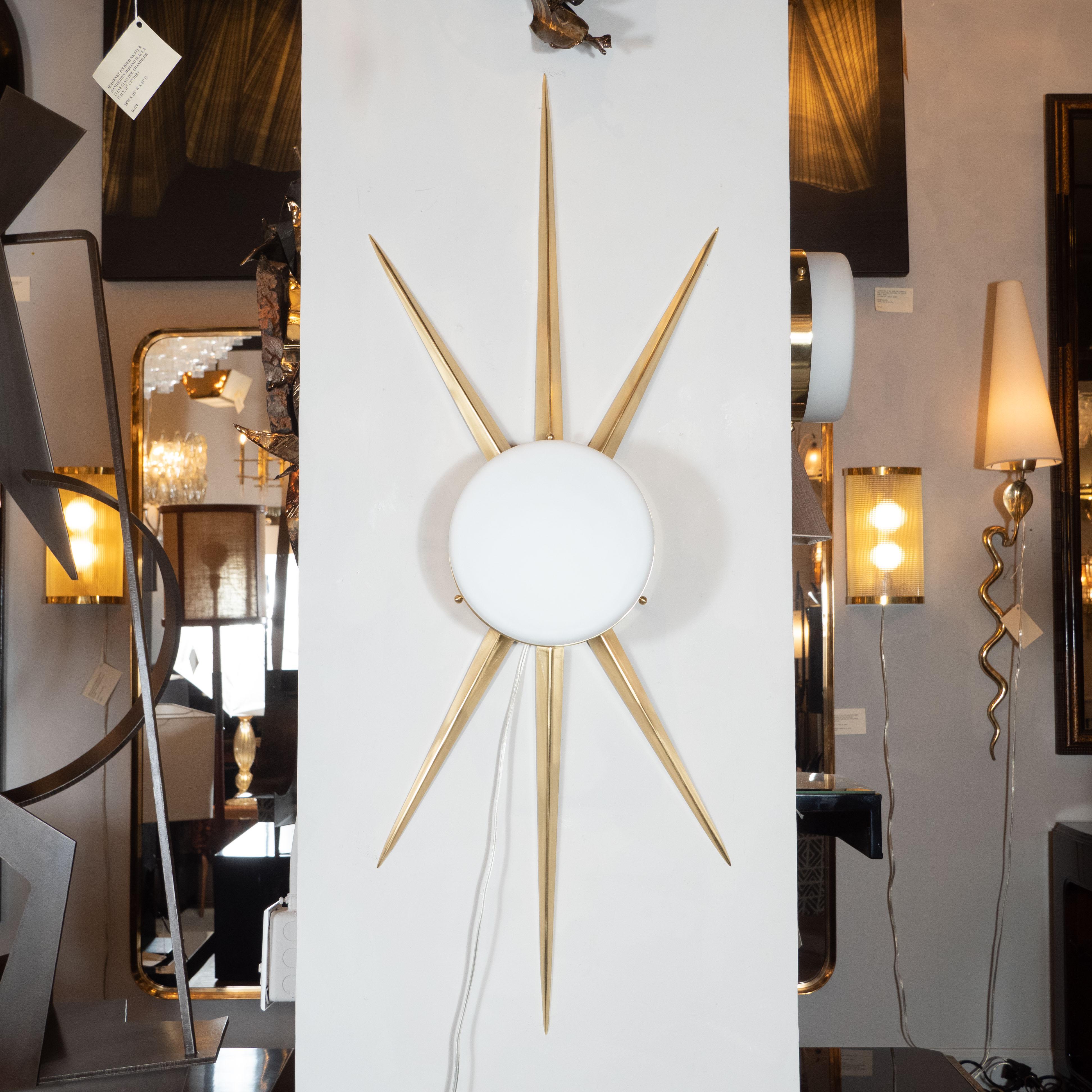This graphic and dramatic pair of modernist sconces were realized in Murano, Italy, the island off the coast of Venice renowned for centuries for its superlative glass production. They feature circular glass shades in hand blown frosted Murano glass