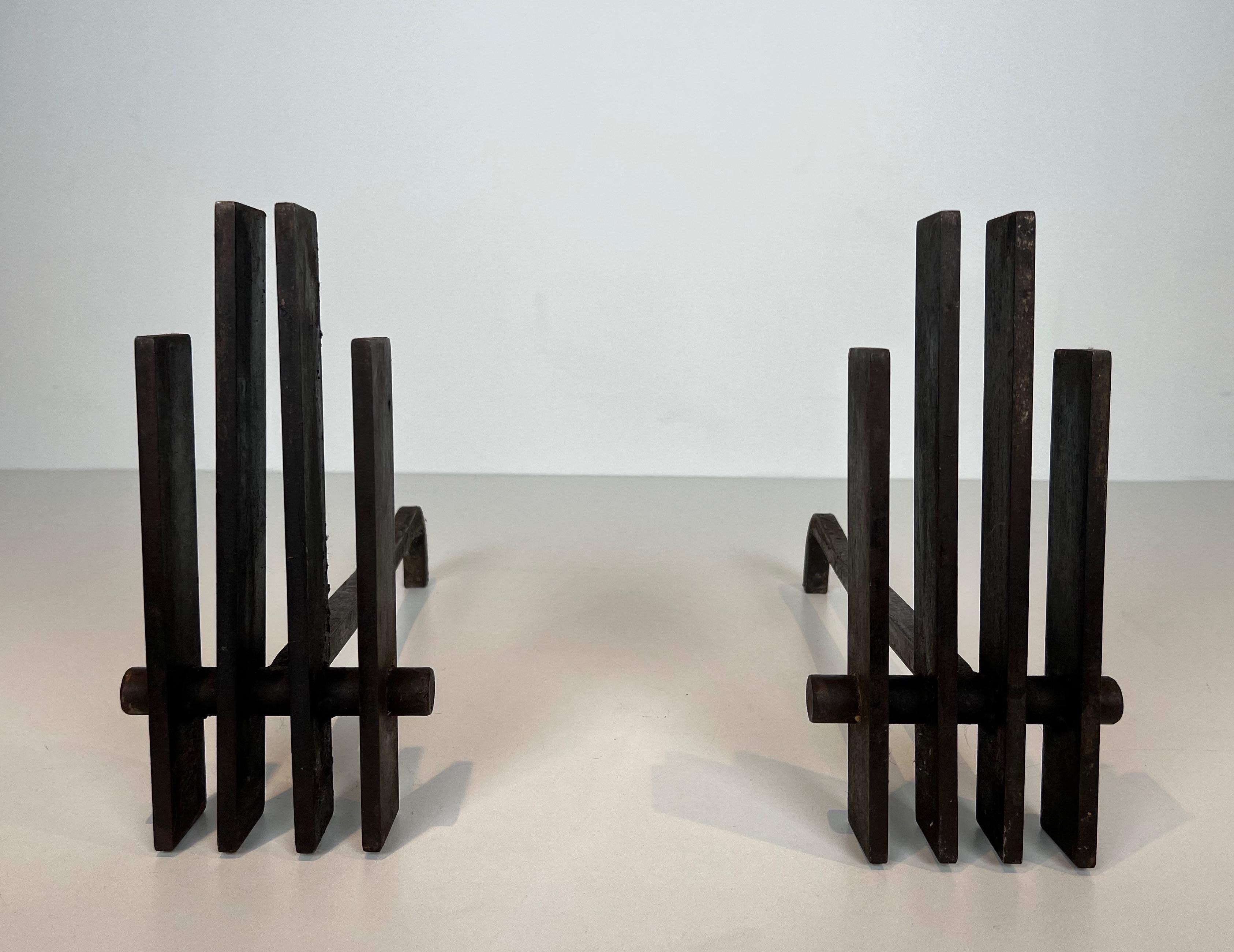 This very nice and interesting pair of modernist andirons are made of steel and iron. This is a French Work. Circa 1970