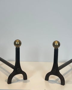 Pair of Modernist Steel, Iron and Brass Andirons attributed to Jacques Adnet