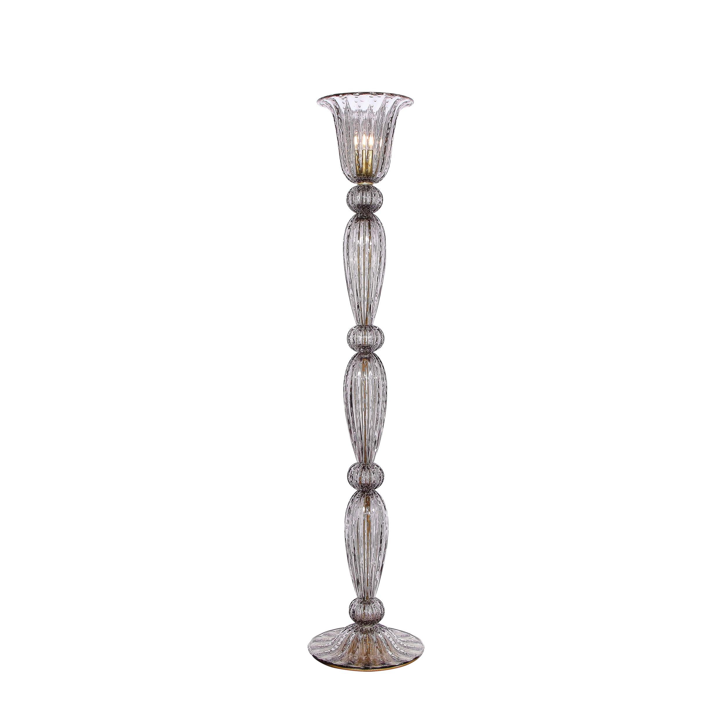 This stunning pair of monumental torchieres were designed by High Style Deco and hand blown in Murano, Italy- the island off the coast of Venice renowned for its superlative glass production. The torchieres feature concave subtly domed bases;